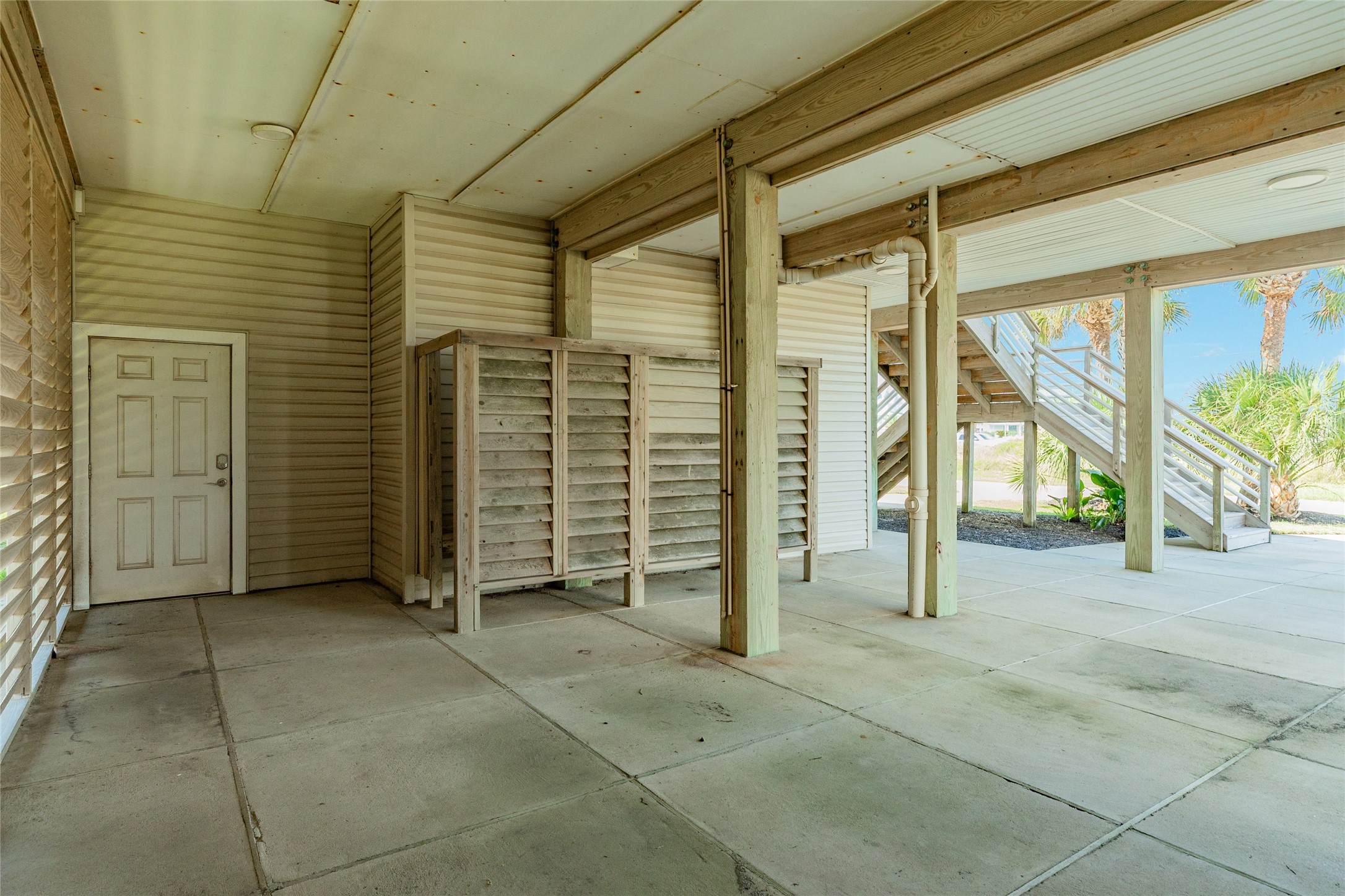 Outdoor shower is perfect for rinsing off after a day at the Beach. Slats on the wall to the left can be removed for beach views