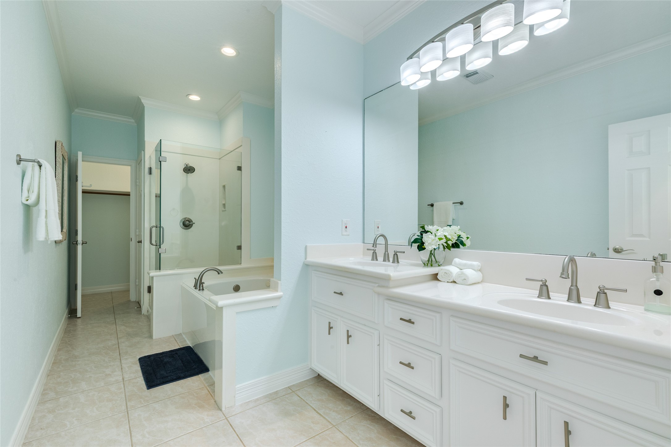 Primary Bathroom has double sinks, a jetted soaking tub, walk-in shower and second closet