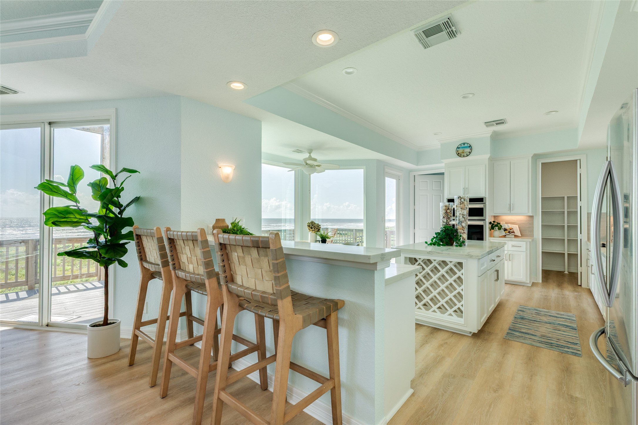 Updated kitchen features a breakfast bar and built-in wine rack