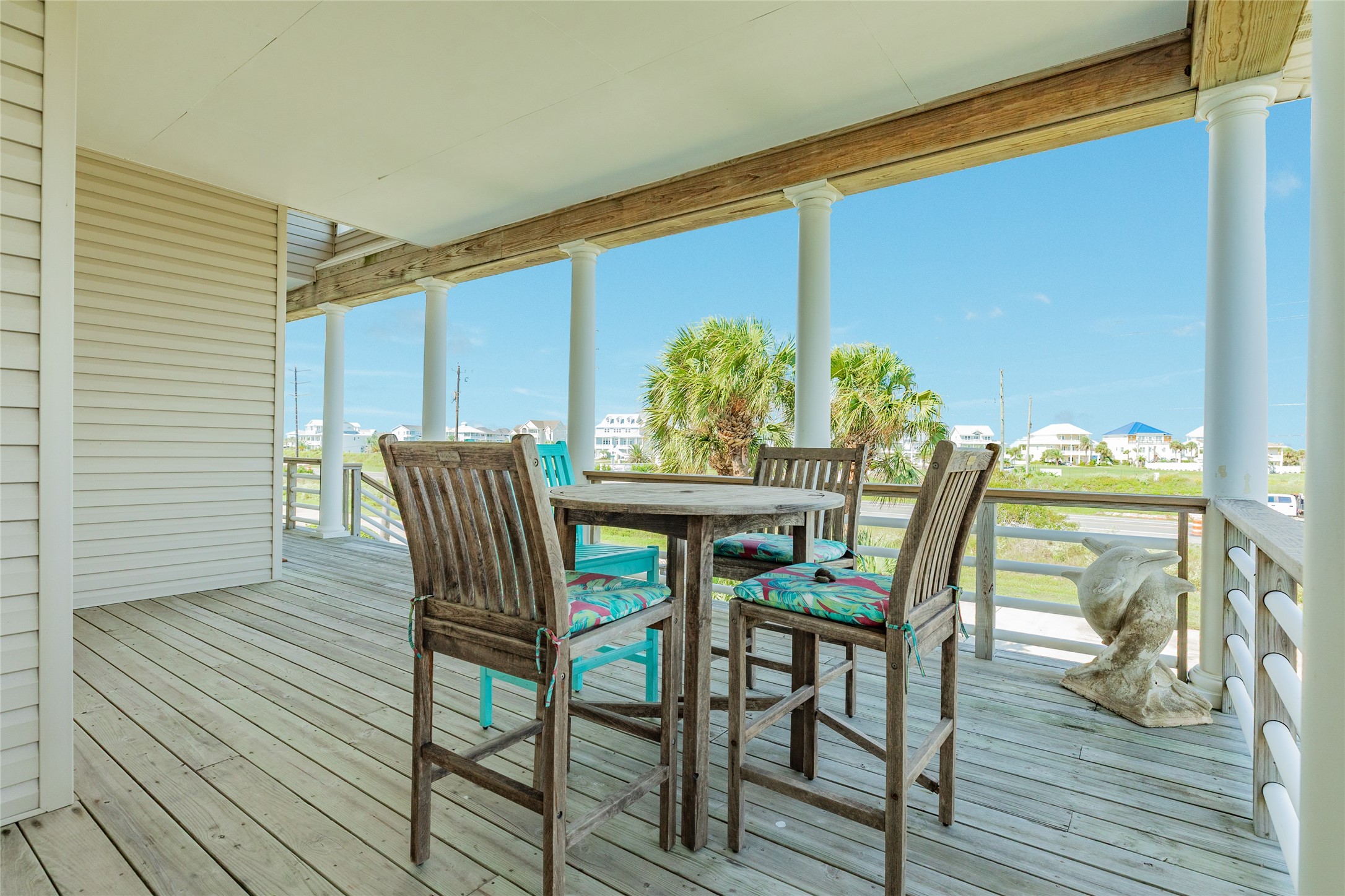 Covered front porch is perfect for watching Galveston's famous sunsets