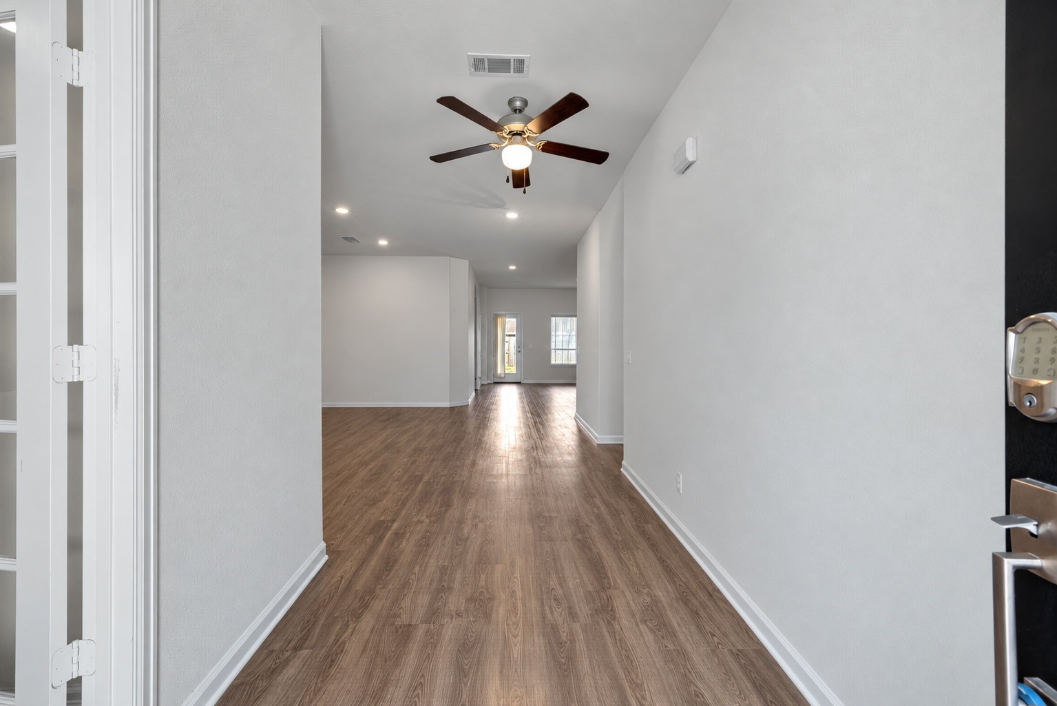 Entry virtually staged without furniture.