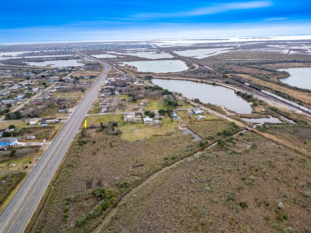 Wide aerial perspective with arrow identifying the subject property and showcasing its position along Highway 6. Wide aerial perspective with arrow identifying the subject property and showcasing its position along Highway 6.