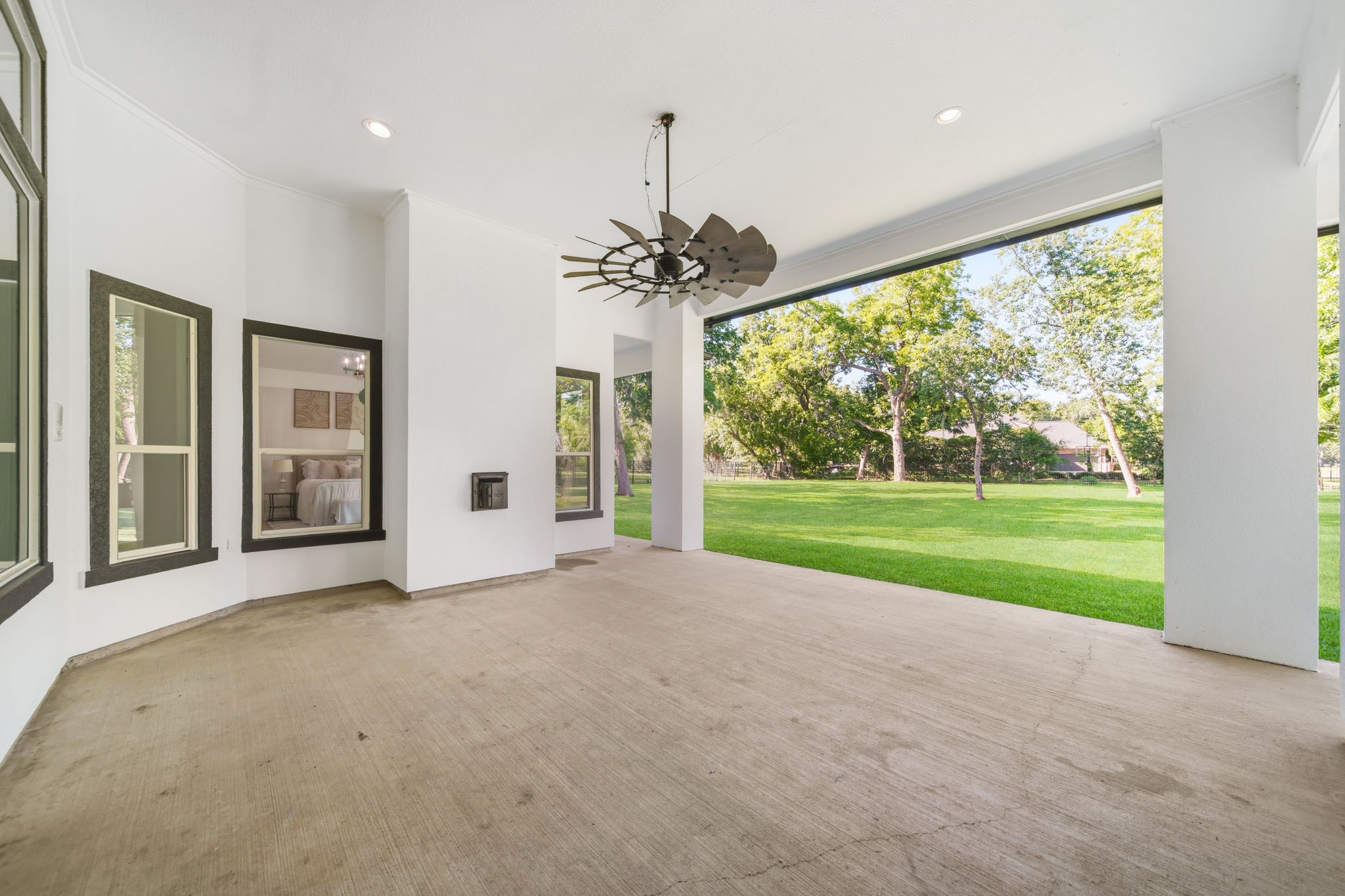 Spacious COVERED PATIO is ideal for entertaining and offers the perfect setup for a future OUTDOOR KITCHEN and dining space.