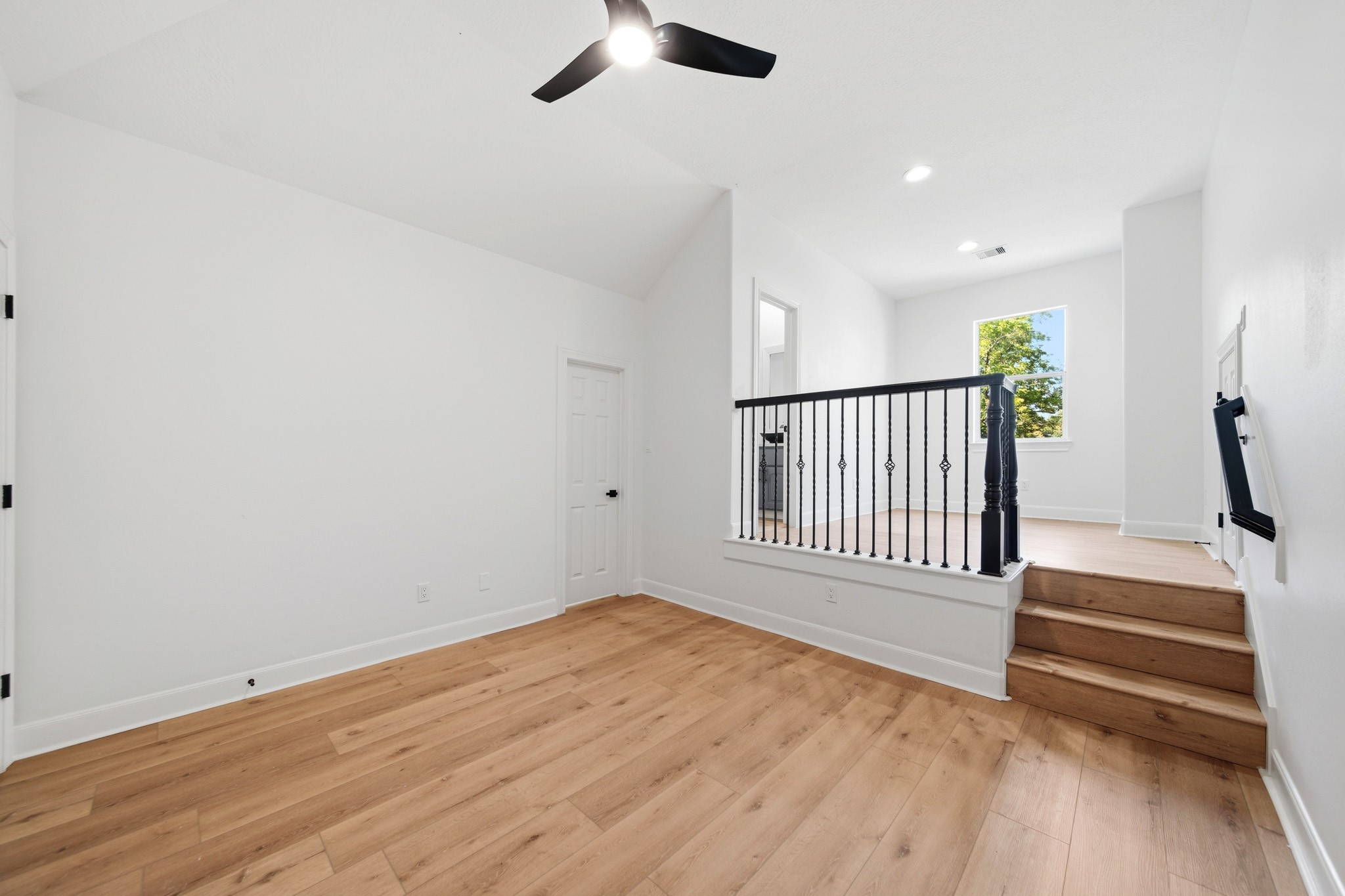 Spacious Bedroom/FLEX SPACE upstairs provides endless possibilities for a game room, second living area, home gym, or office.