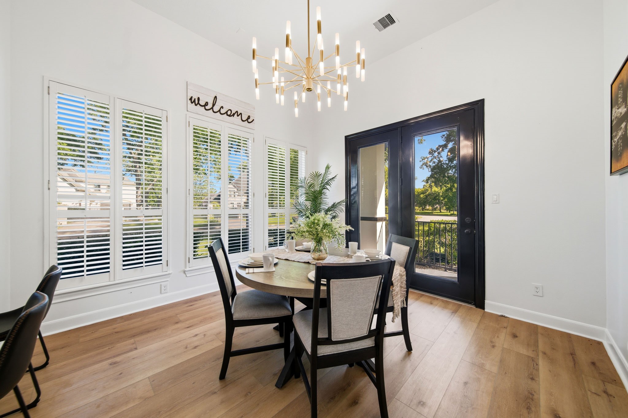 Light-filled BREAKFAST AREA offers natural lighting, and access overlooking the beautiful front grounds.