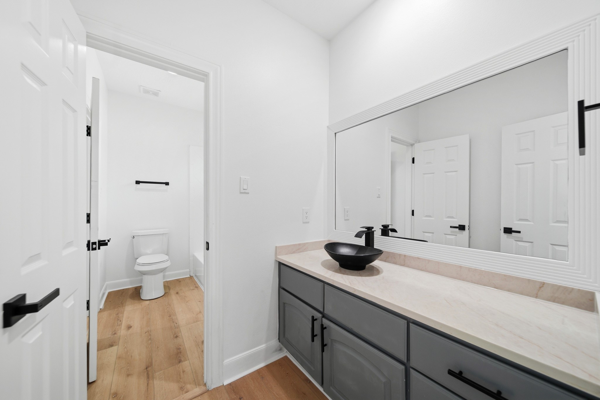 Modern secondary bathroom featuring elegant finishes and generous counter space.