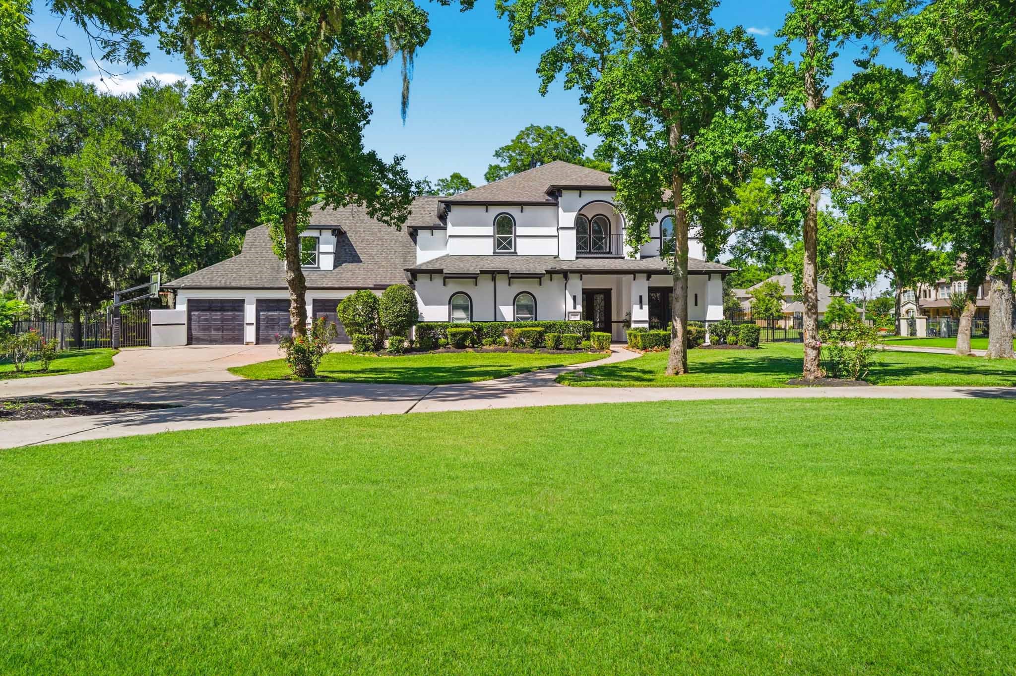 Exceptional curb appeal with modern architecture set on a sprawling, tree-lined lot.