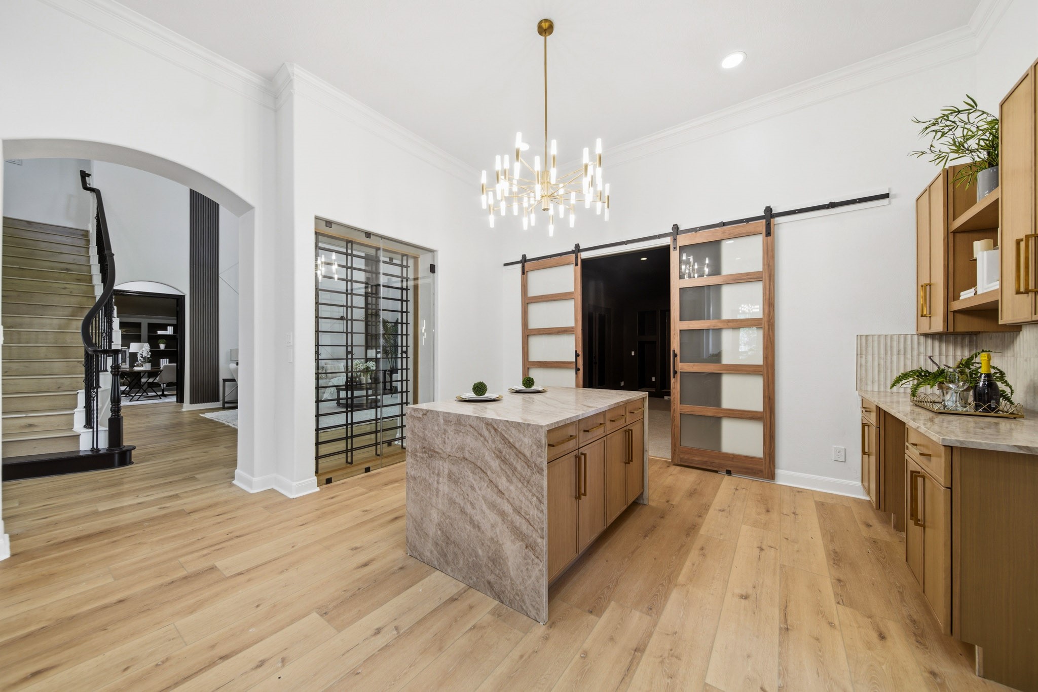 Beautiful kitchen with expansive counters, custom details, and seamless flow into living areas.