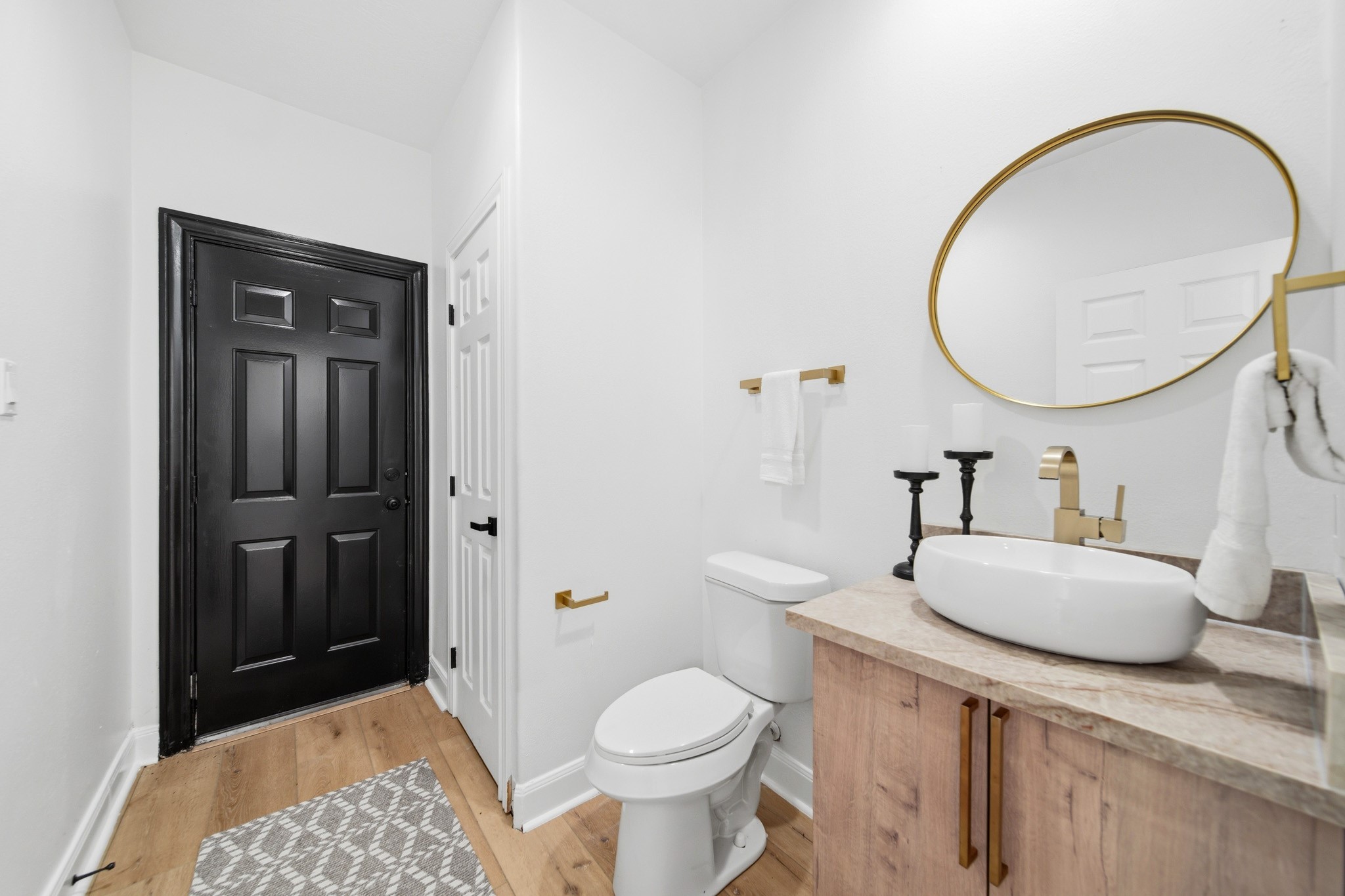 Chic guest bathroom with modern fixtures and warm contemporary finishes.
