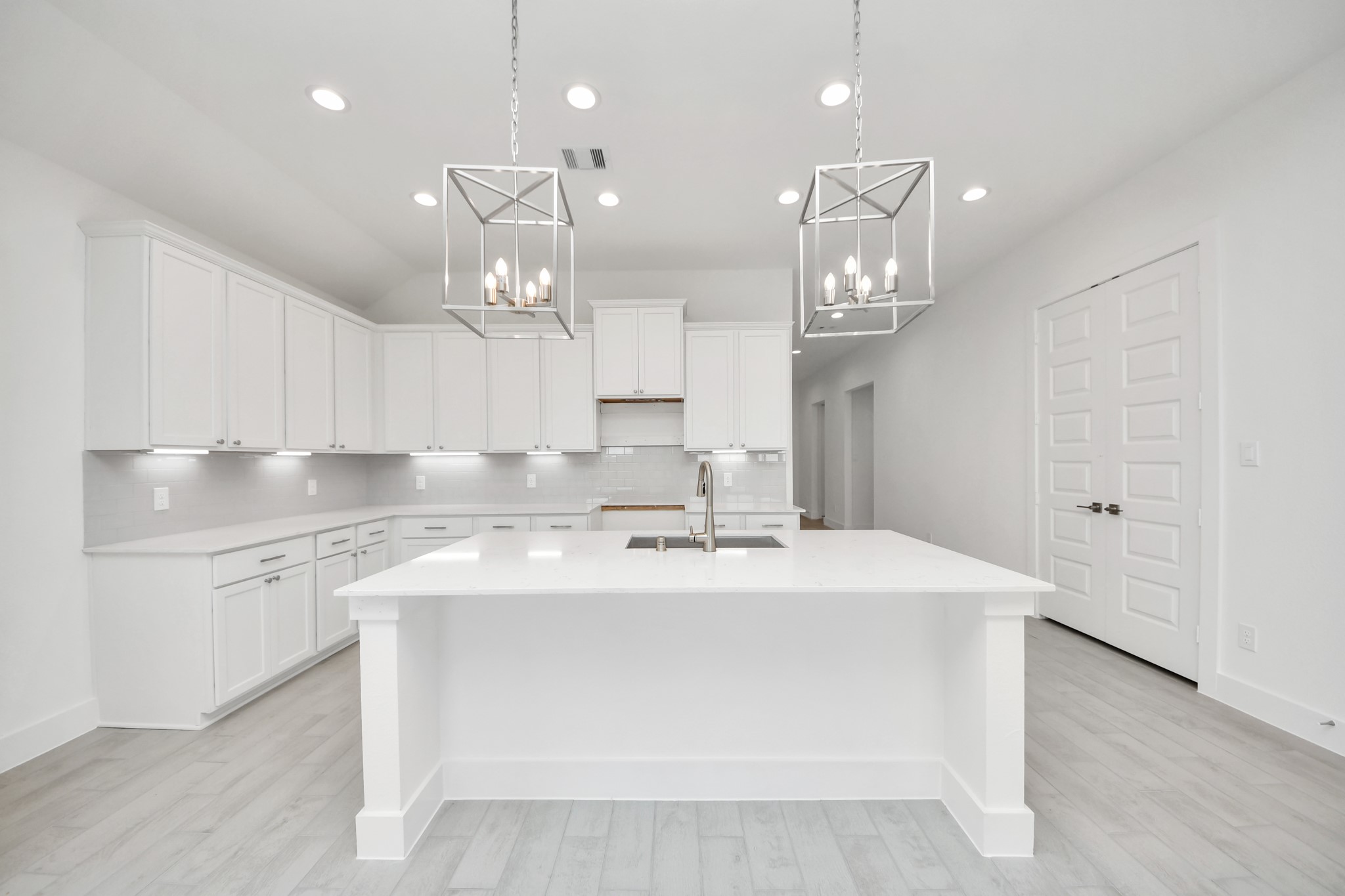 The open concept effortlessly connects the kitchen to the expansive family room, forming a perfect hub for gatherings. This seamless flow creates an inviting space where cooking and socializing come together harmoniously. Sample photo of completed home with similar floor plan. Actual colors and selections may vary.