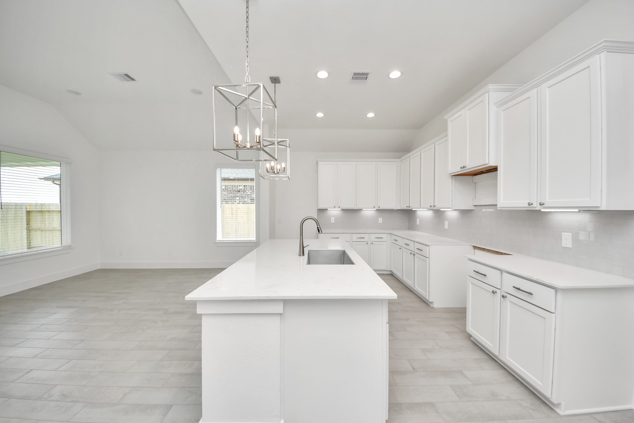 The extended counter area adds both practicality and style, making meal preparation a breeze. Every detail is thoughtfully designed to enhance the kitchen's functionality and aesthetic appeal. Sample photo of completed home with similar floor plan. Actual colors and selections may vary.