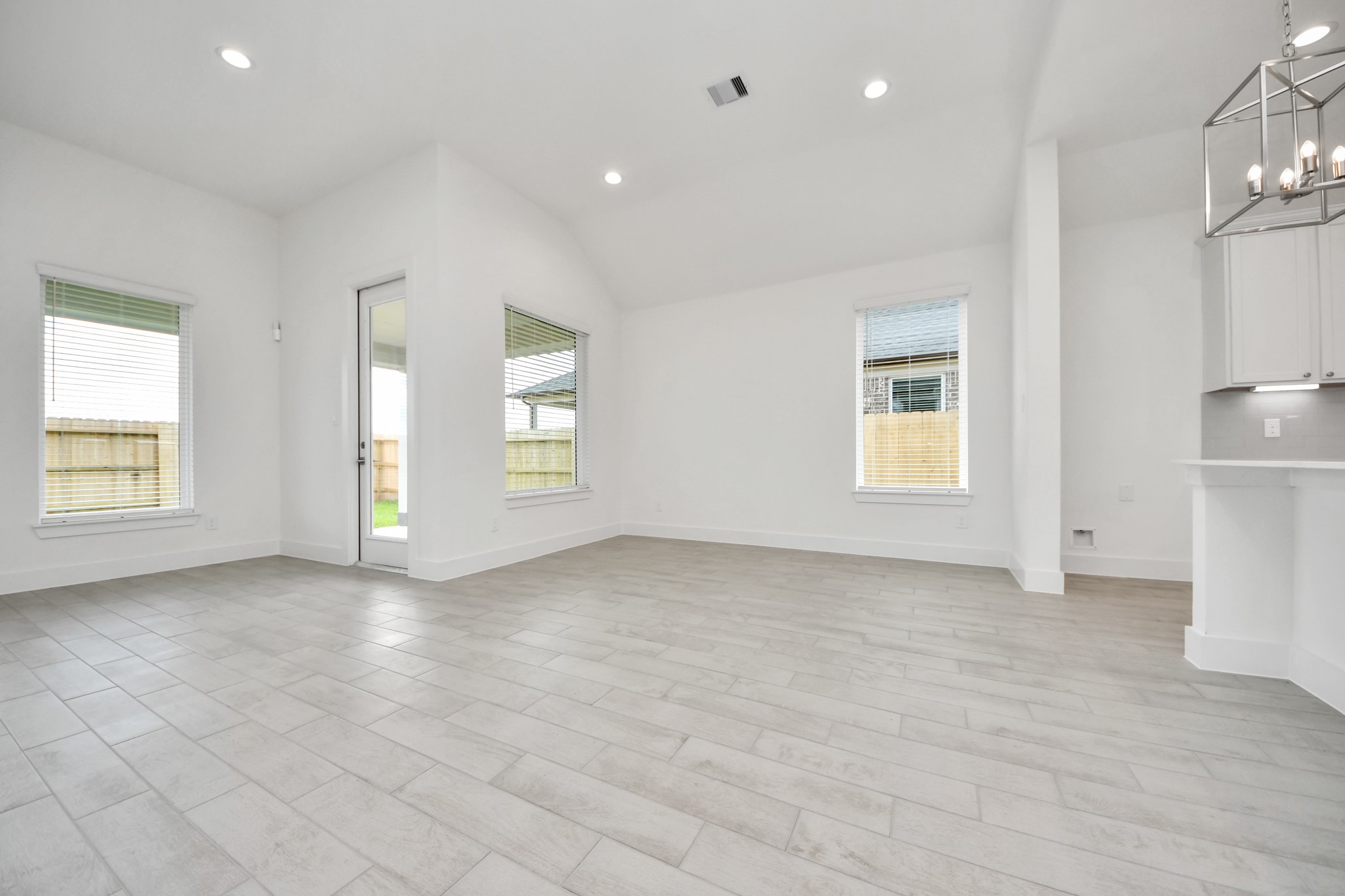 Enjoy breakfast with ease in the connected and cozy breakfast area, seamlessly integrated with the kitchen for utmost convenience. Step through the back door for a breath of fresh air onto the covered patio, extending your living space to the outdoors. Sample photo of completed home with similar floor plan. Actual colors and selections may vary.