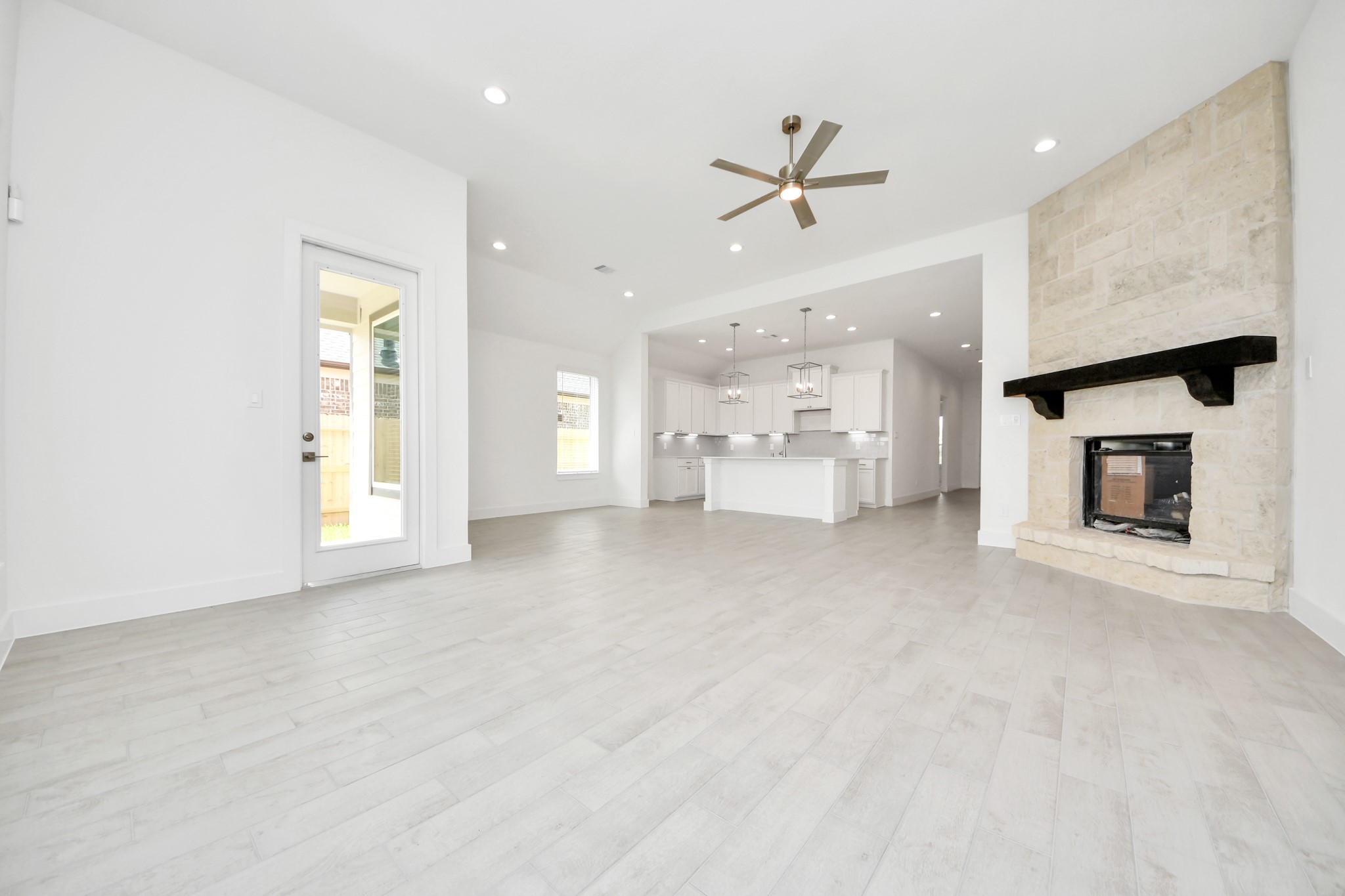Take another glimpse into the heart of the home with this additional view of the family rooma sprawling space ready to accommodate all your gatherings. Sample photo of completed home with similar floor plan. Actual colors and selections may vary.