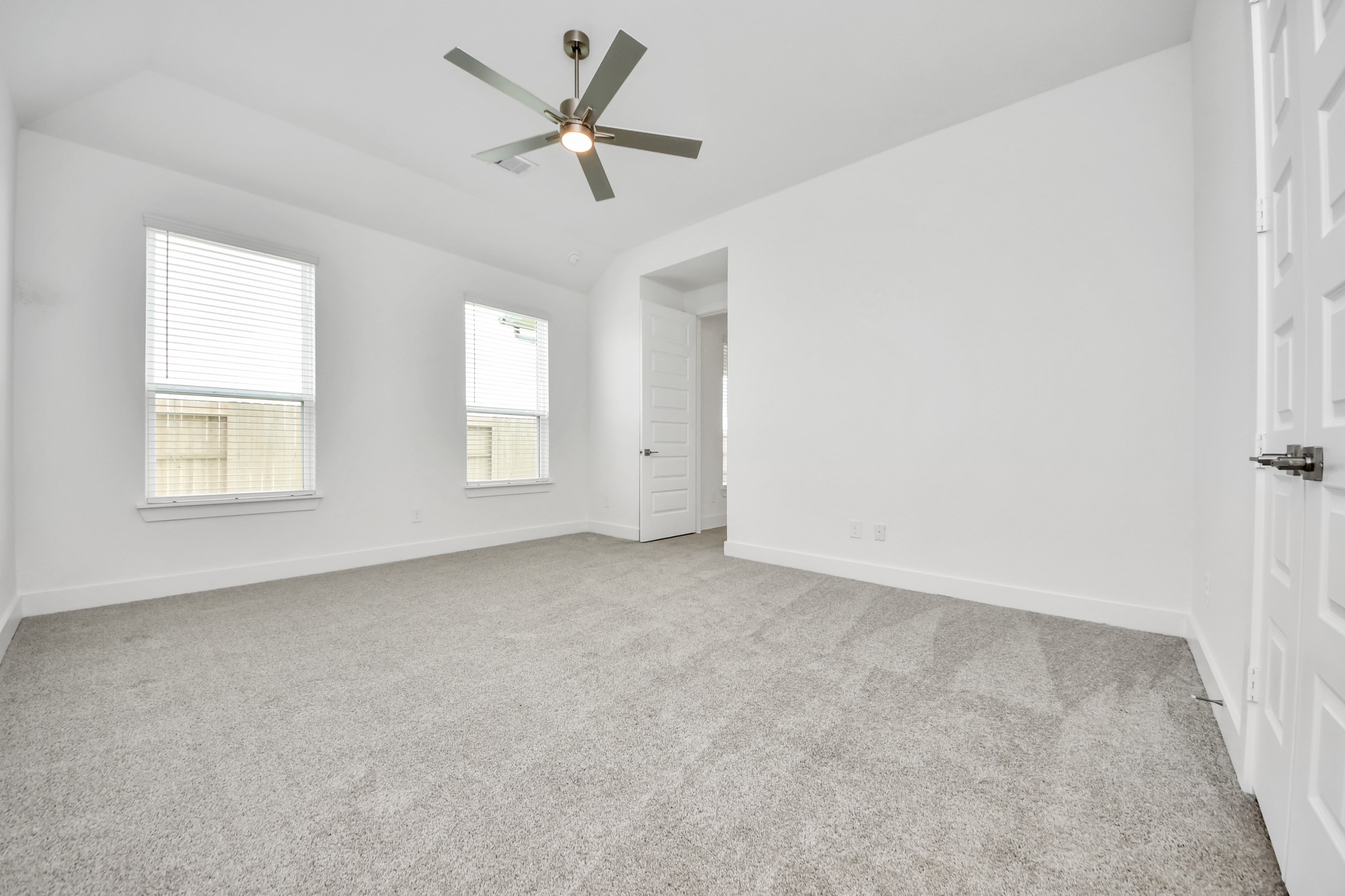 Another perspective unveils a comprehensive view of the serenity and comfort this primary suite offers. Sample photo of completed home with similar floor plan. Actual colors and selections may vary.