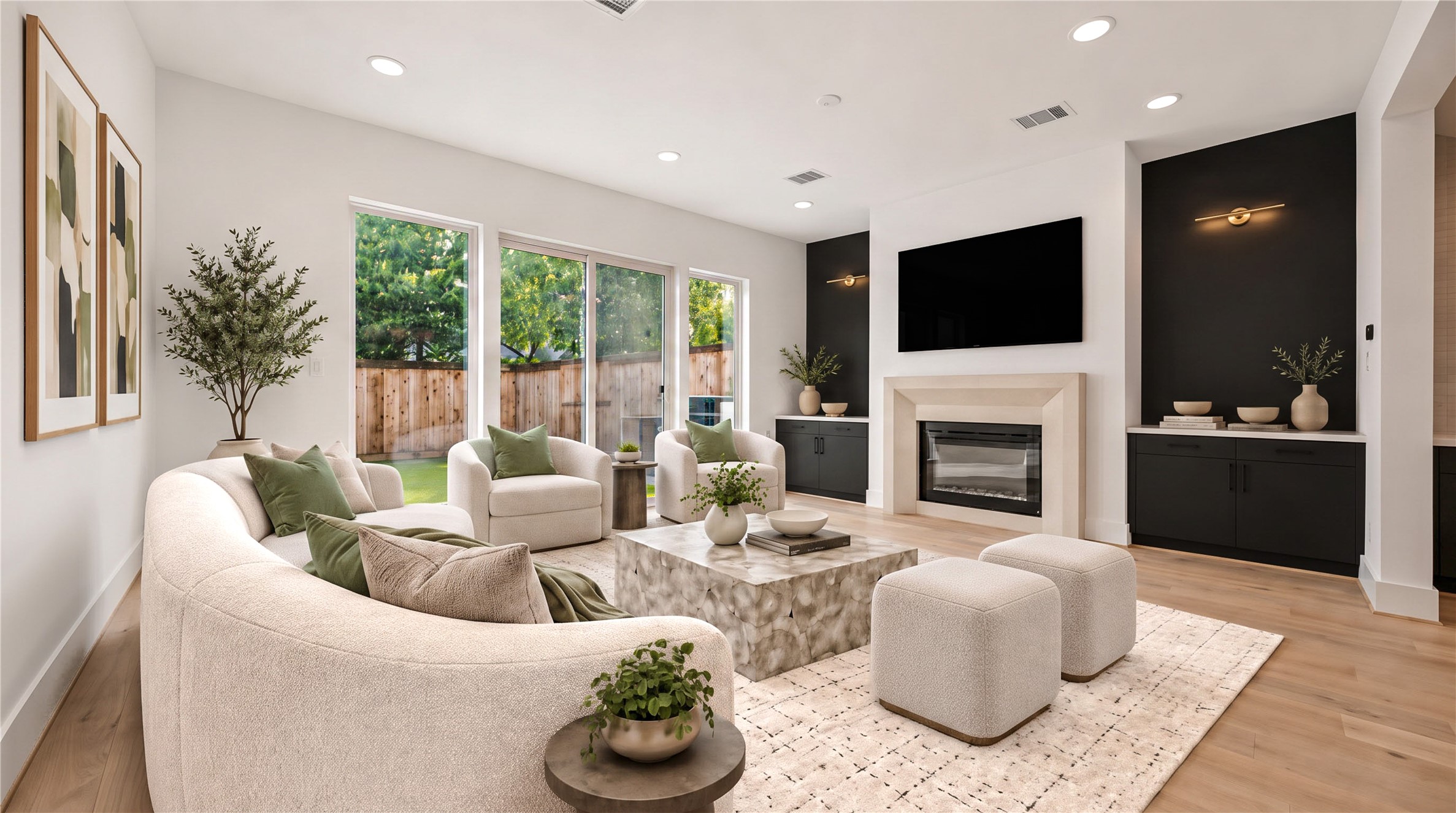 Living room  a wall of sliding glass doors fills the space with natural light and opens to the backyard. (virtual staging)