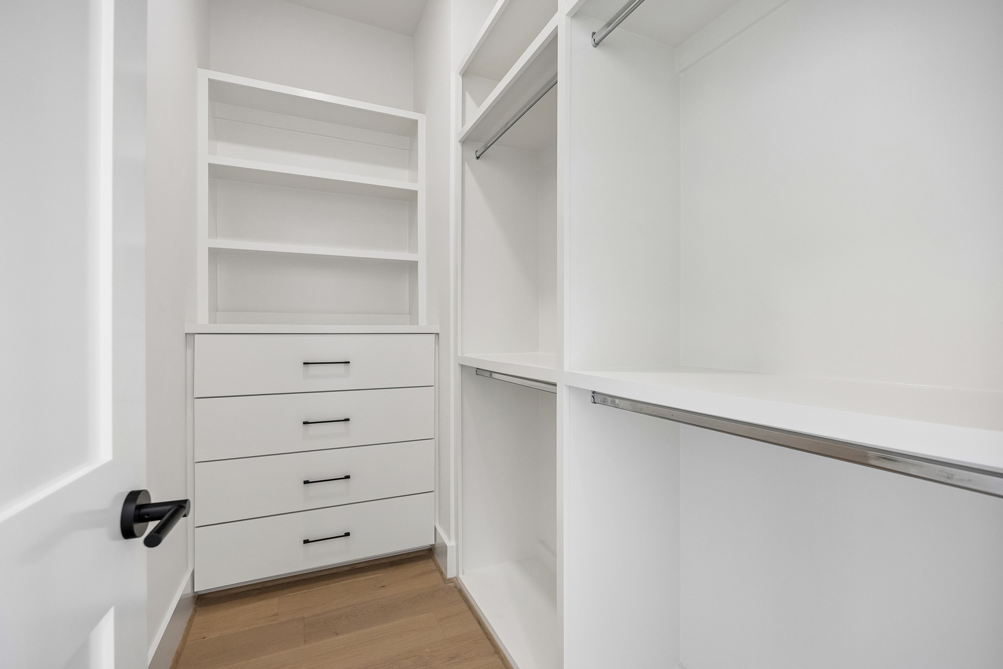 Walk-in closet with custom built-ins.