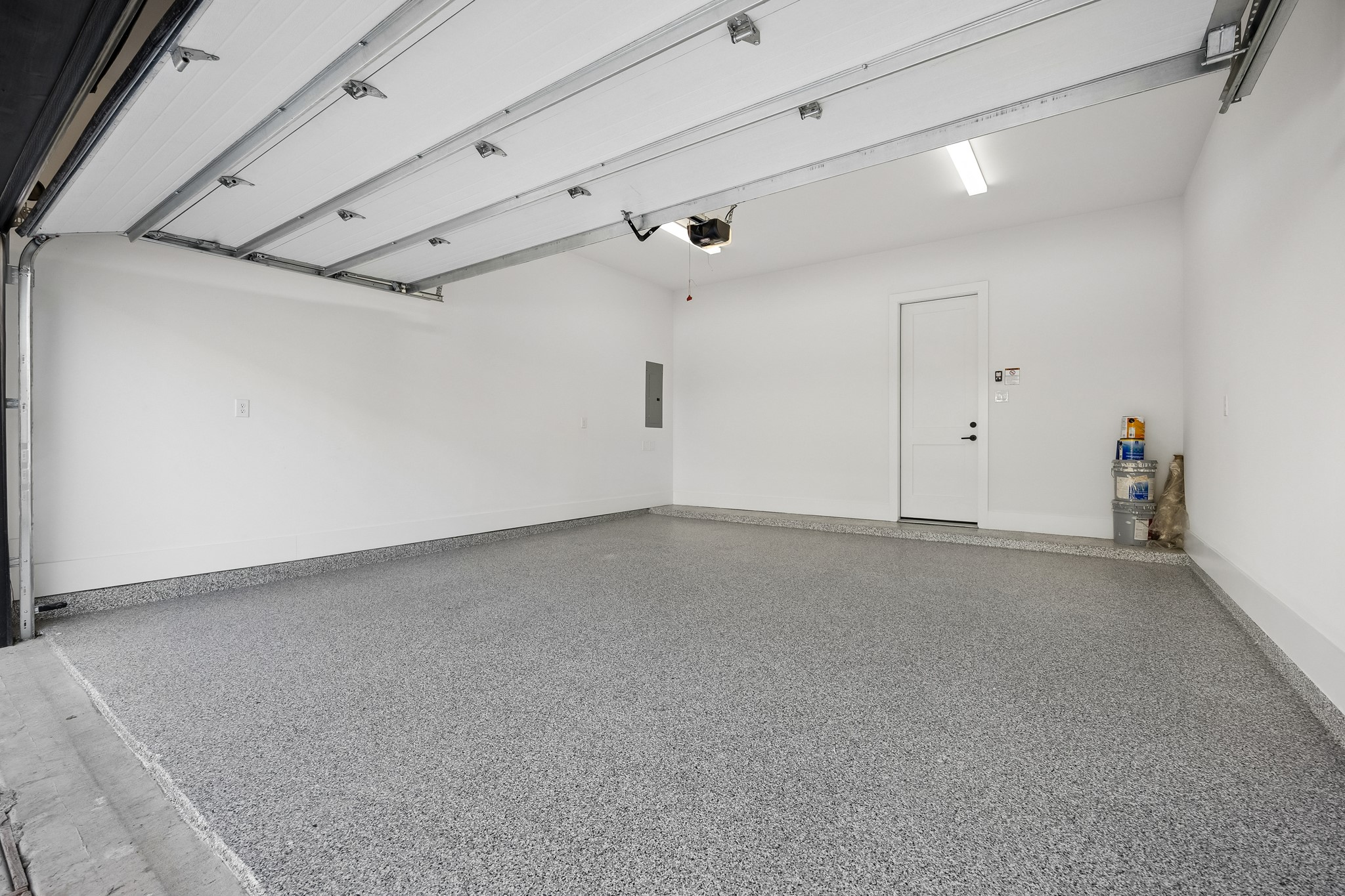 2-car garage with epoxy flooring.