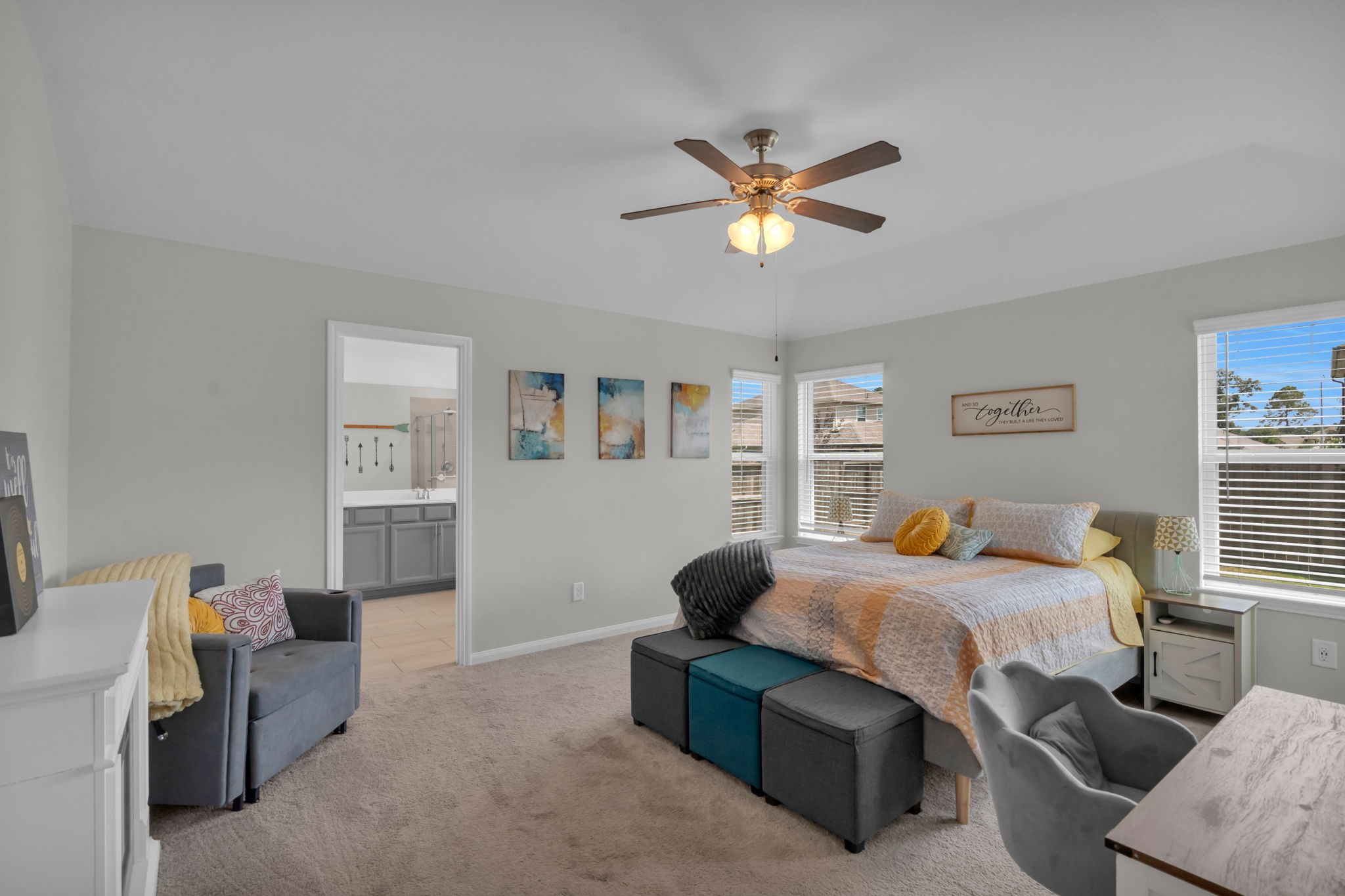 Secluded primary bedroom with backyard views and a private en suite.