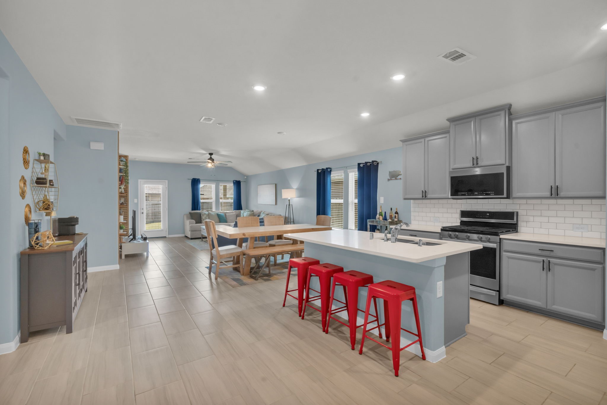 This kitchen seamlessly flows into the breakfast nook and living area, creating a welcoming layout perfect for everyday living and entertaining.