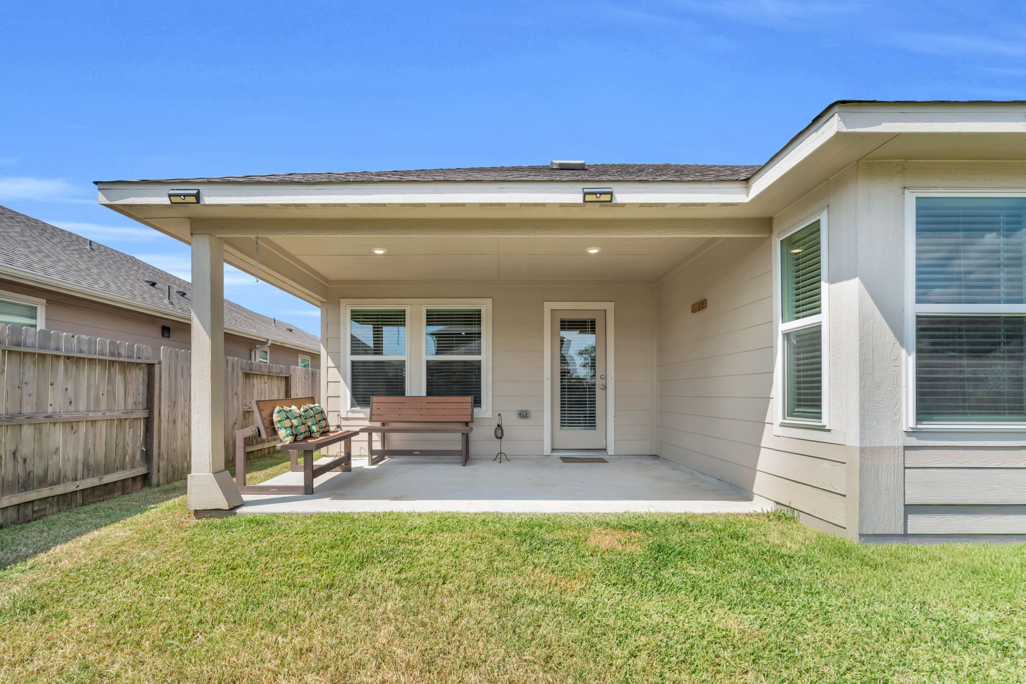 Complete look at the covered patio that is perfect for relaxing outdoors.