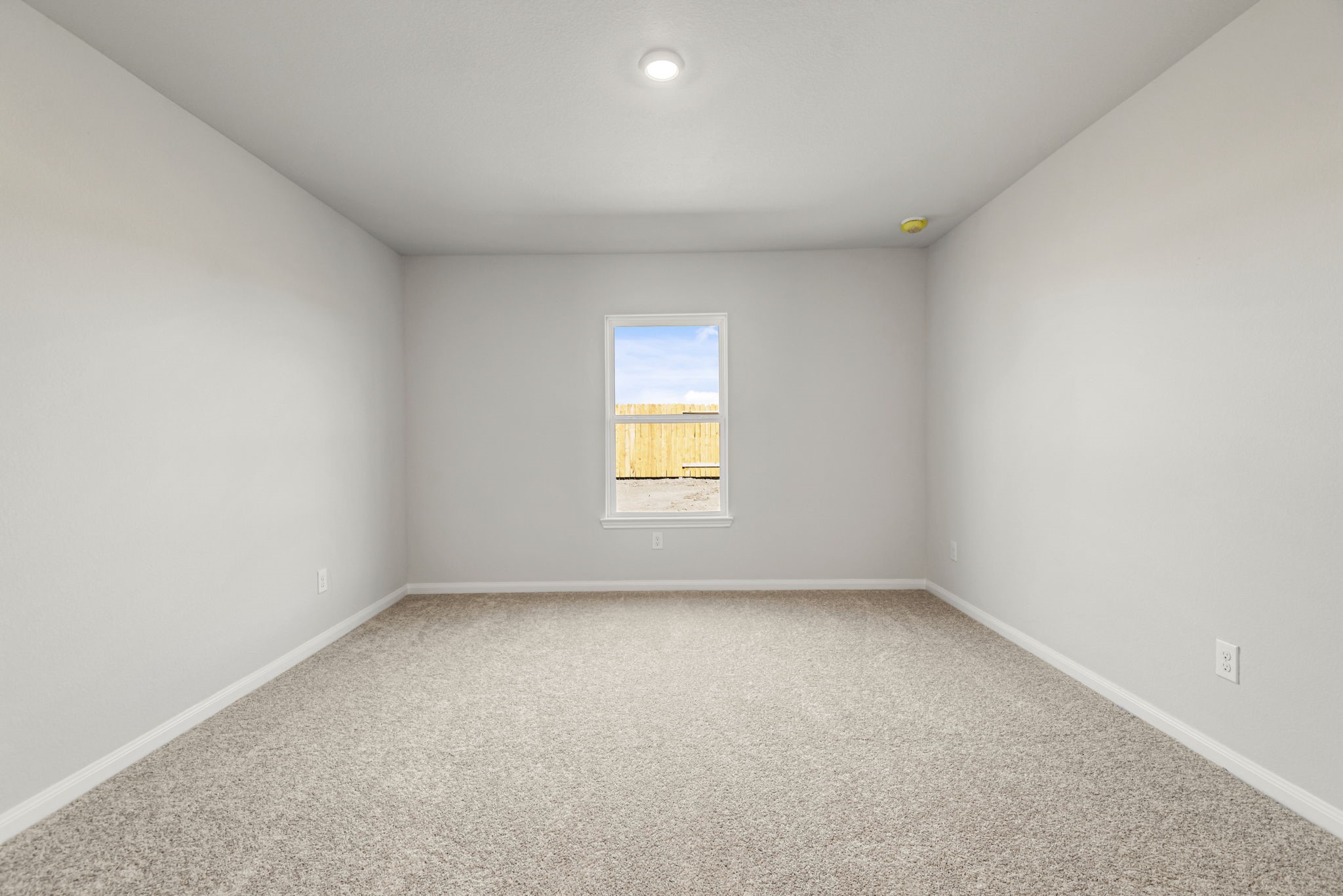 The primary bedroom is a great place to relax after a long day, and its large enough for the king-sized bed!
