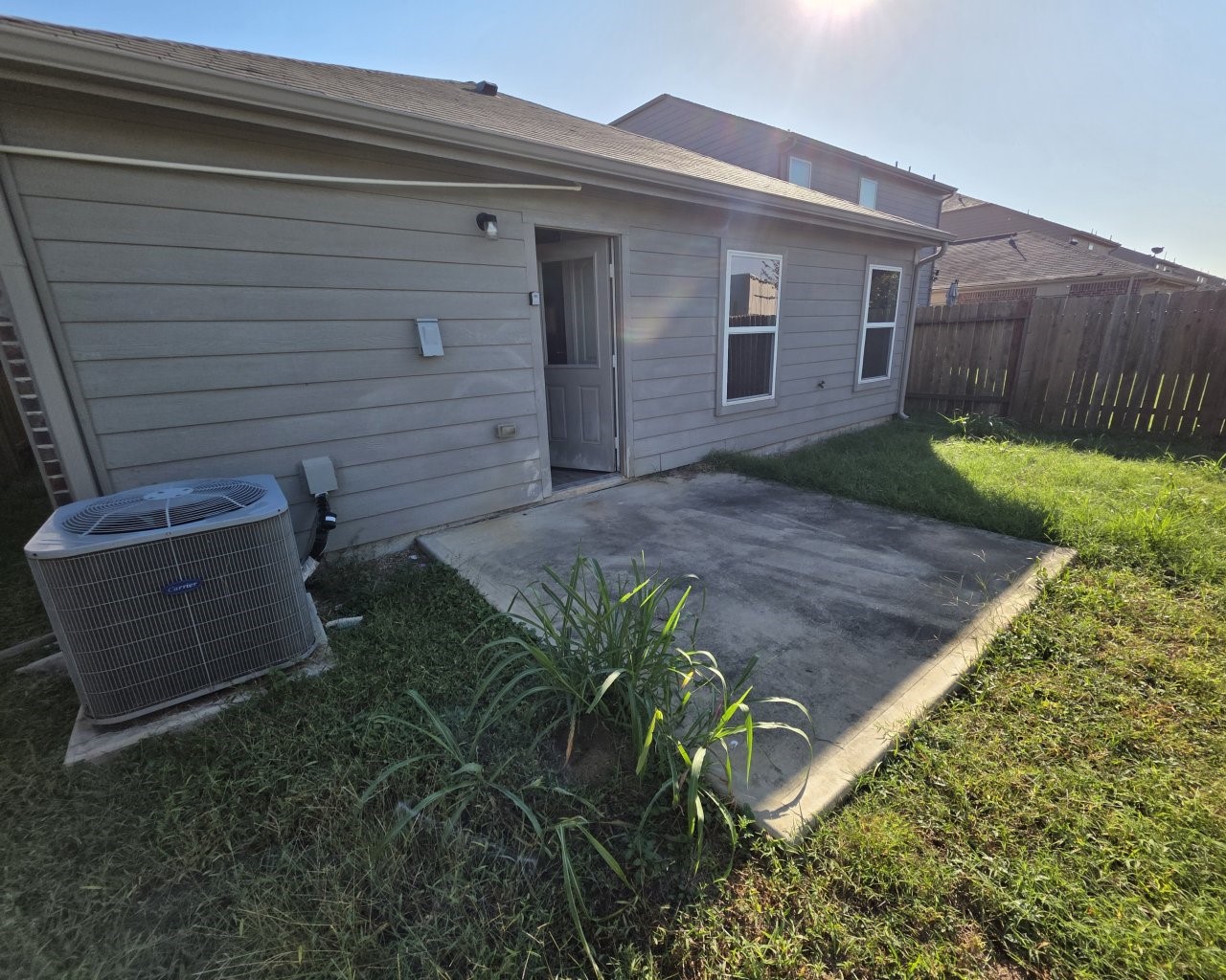 Fenced back yard is great for pets and gardeners