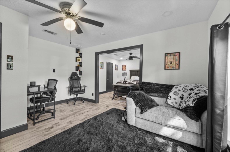 Another view of the flexible sitting and office area and its connection to the adjoining room.