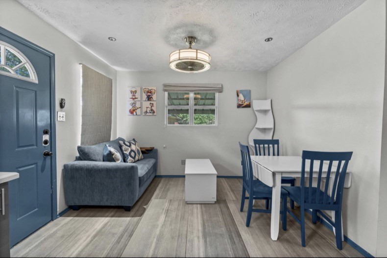 Separate guest-suite living and dining area located beside its full kitchen.