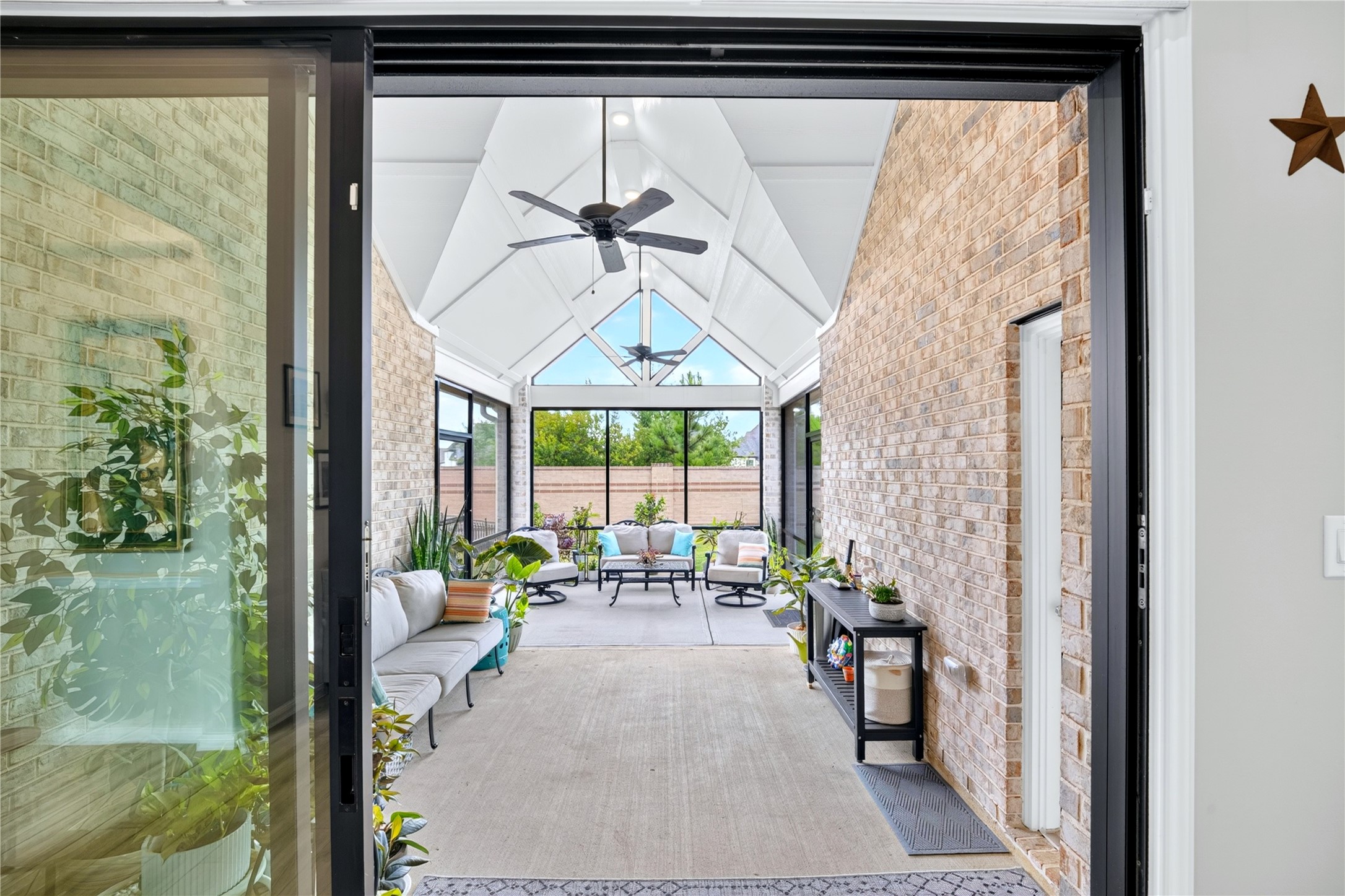 Relax and unwind where indoor comfort meets the outdoors. This beautifully screened porch 
(282 SQ.FT. 12'x23.5') features sliding door access, two entry points, and oversized screened windows overlooking gorgeous landscaped grounds. Great spot to entertain and soak in every season.