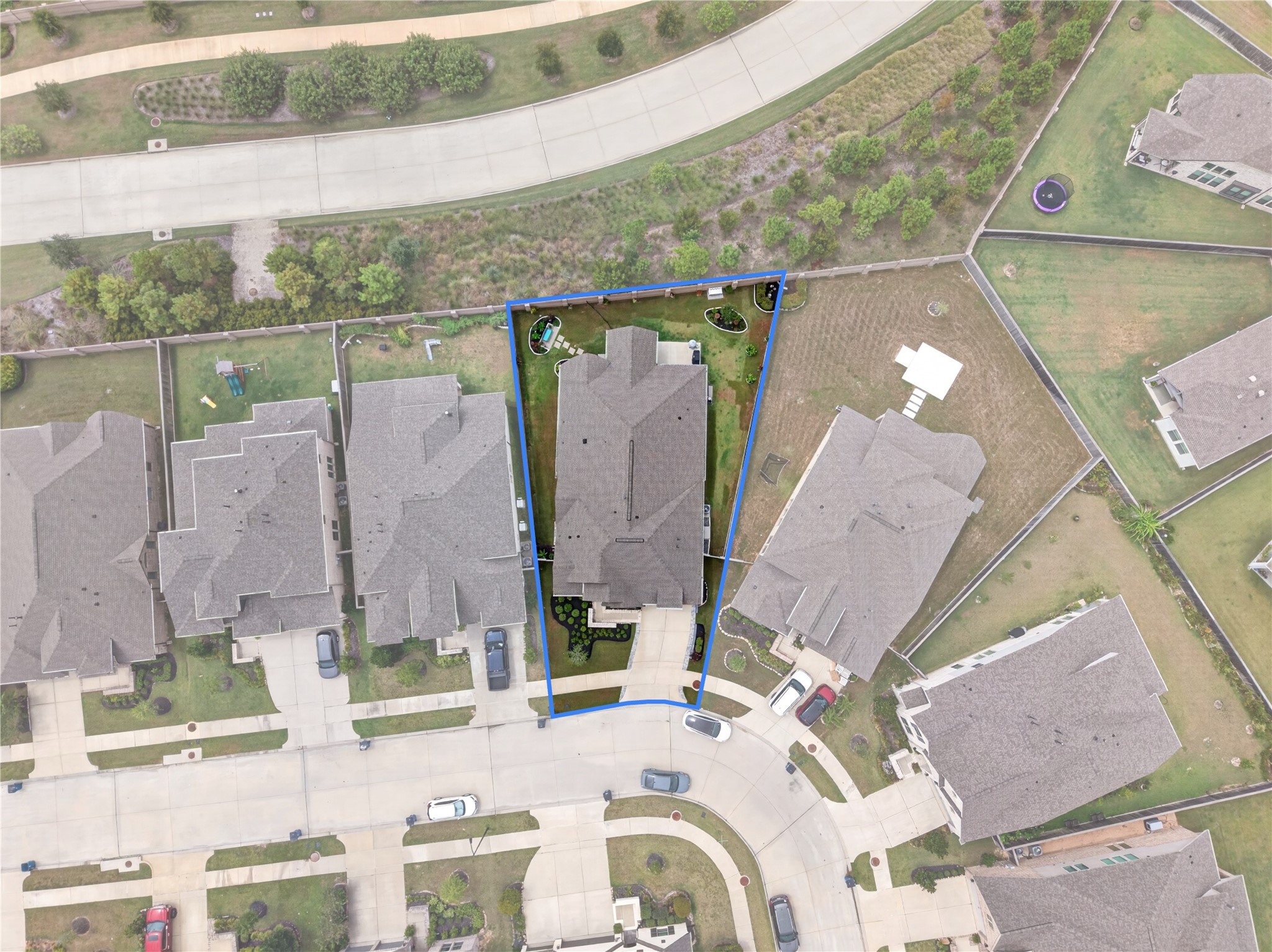 Aerial View of this home with a peaceful setting surrounded by greenbelts with no immediate rear neighbors offering added privacy and an open view.