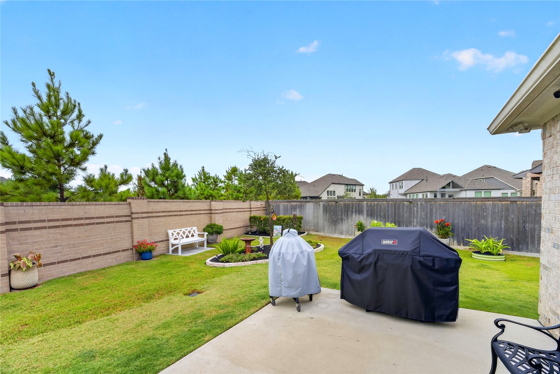 Extended deck just off the covered patio, perfect for grilling and outdoor entertaining. Beautifully landscaped gardens create a private and inviting backyard retreat. A must-see home inside and out!