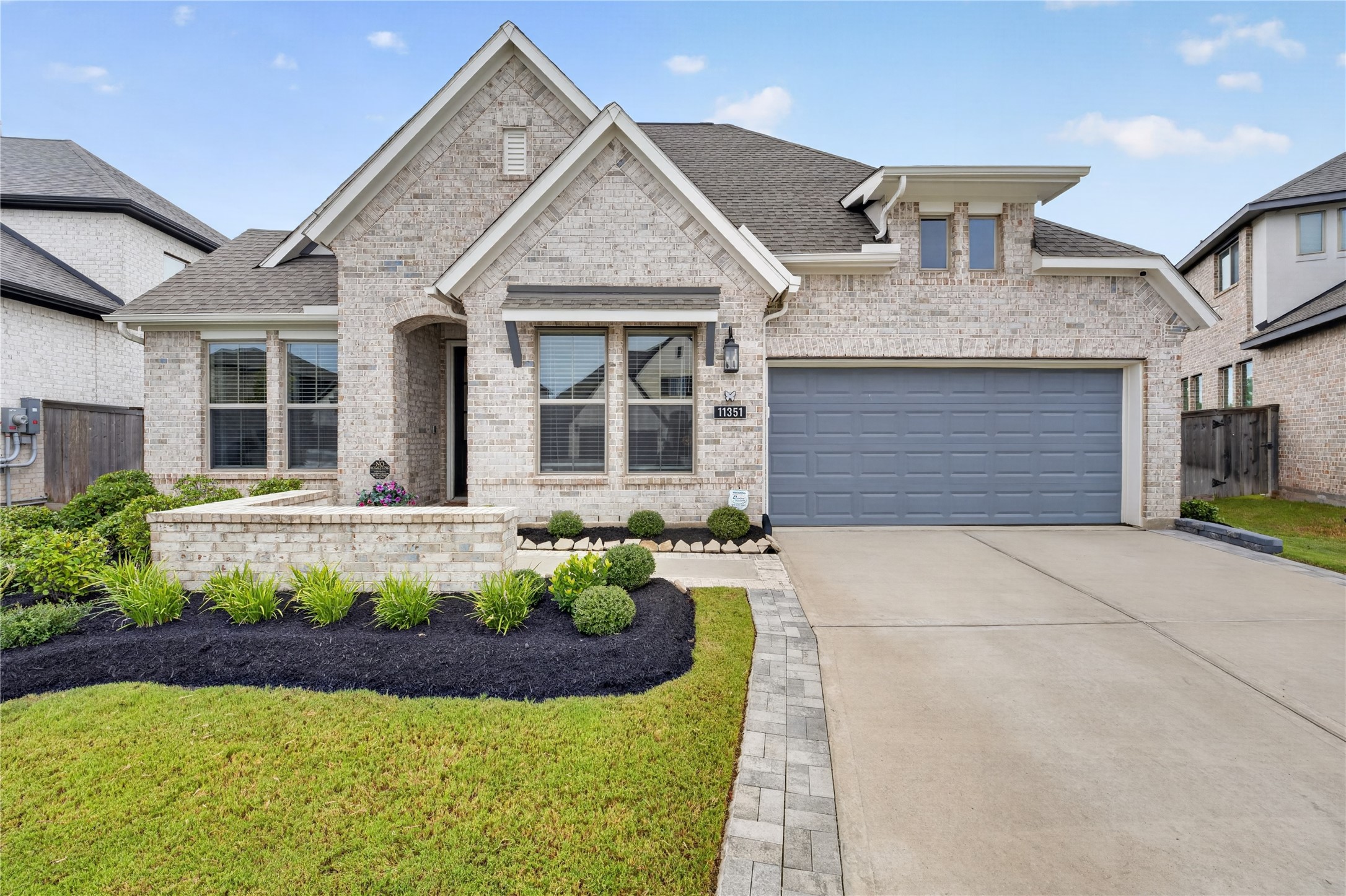 Beautiful curb appeal welcomes you home. This single story, all-brick home features distinctive elevation, inviting front windows, beautifully landscaped grounds and expanded driveway, gutters, and a front and back sprinkler system. The 3-car tandem garage adds exceptional convenience and storage.