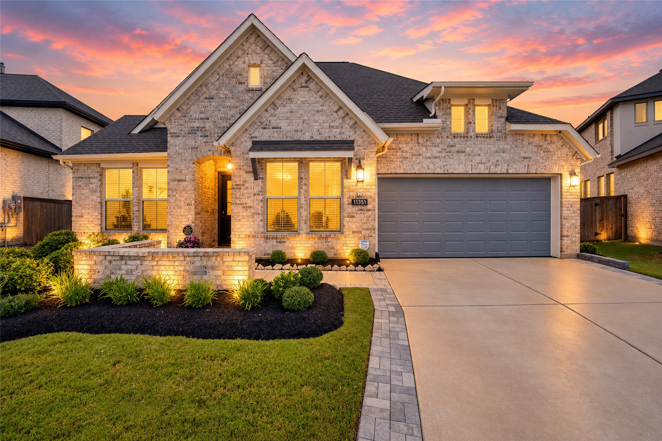 Wow curb appeal starts here. This home boasts brick all around, an extended driveway, and beautifully manicured landscaping, all complemented by a spacious 3-car tandem garage.