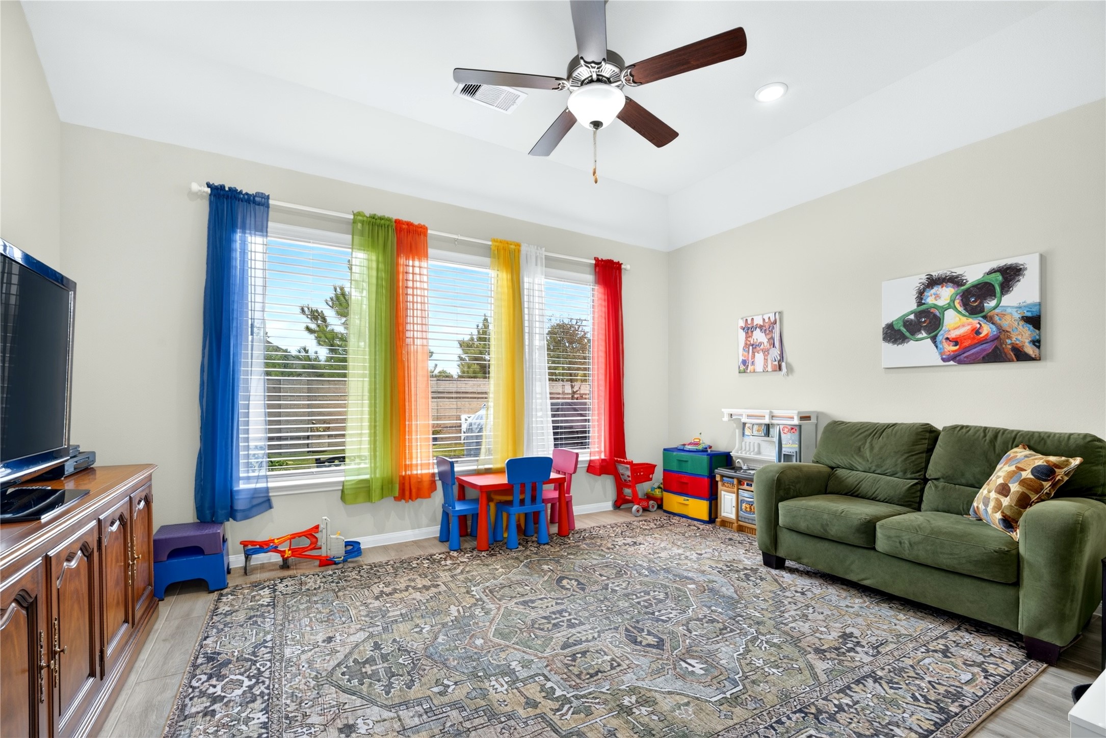 Spacious game room offers endless possibilities and is currently enjoyed as a fun kid's playroom. The generous space can be easily be transformed into a media room, home gym, hobby space, or additional entertaining area.