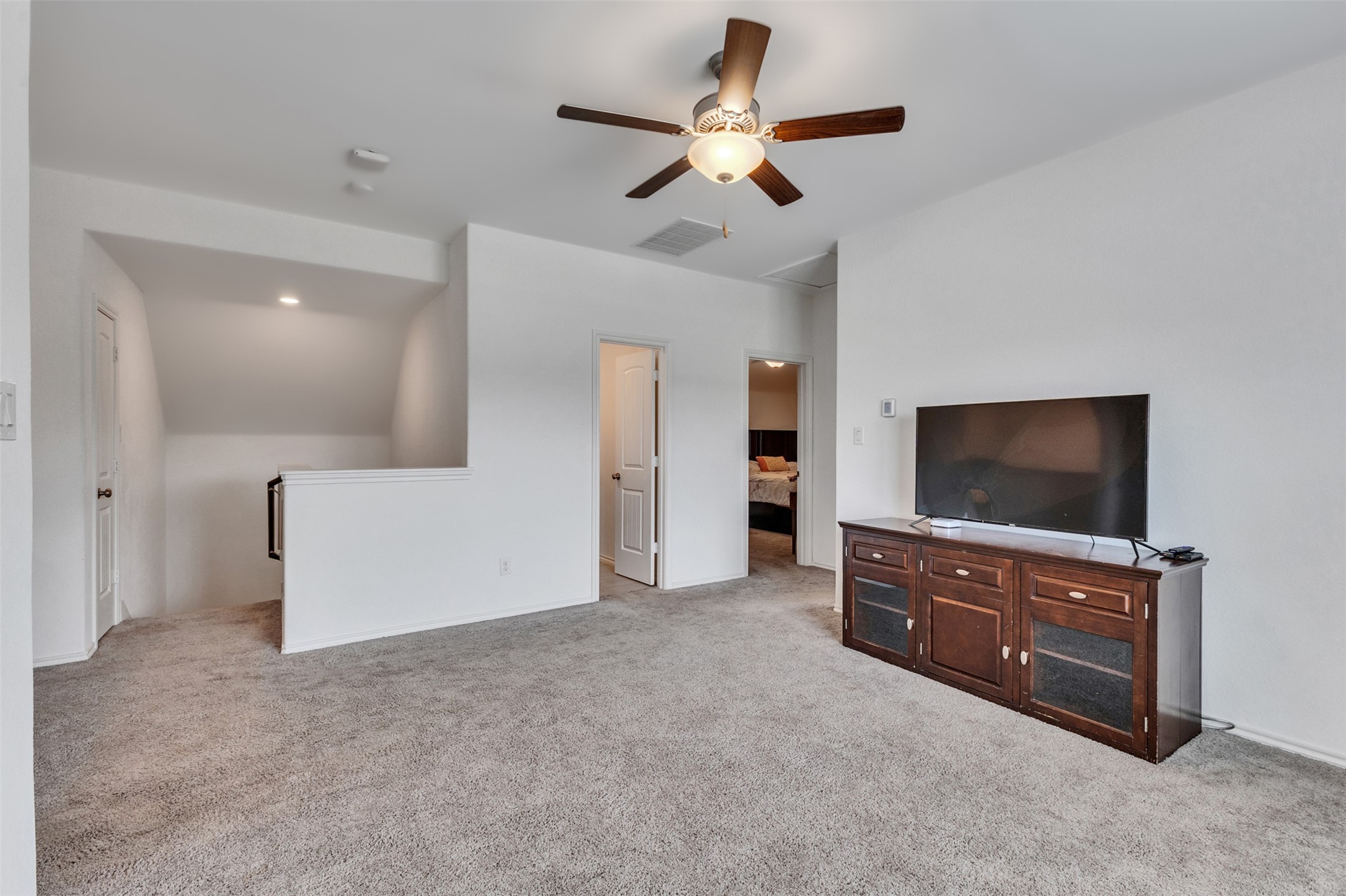 An upstairs playroom adds opportunity for an extra living space or fun and games.