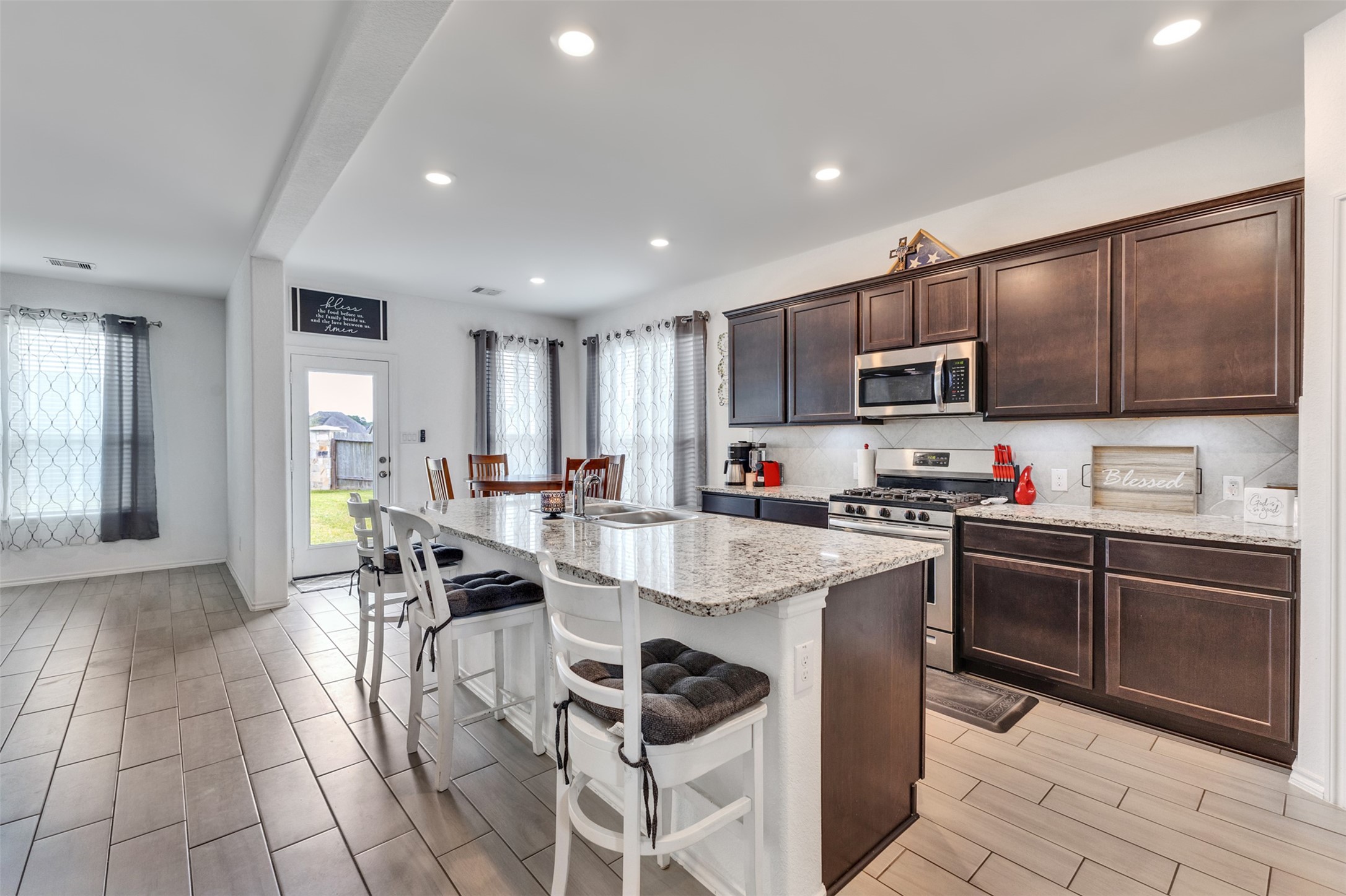 Granite countertops, stainless appliances and an efficient layout will please the family chef.
