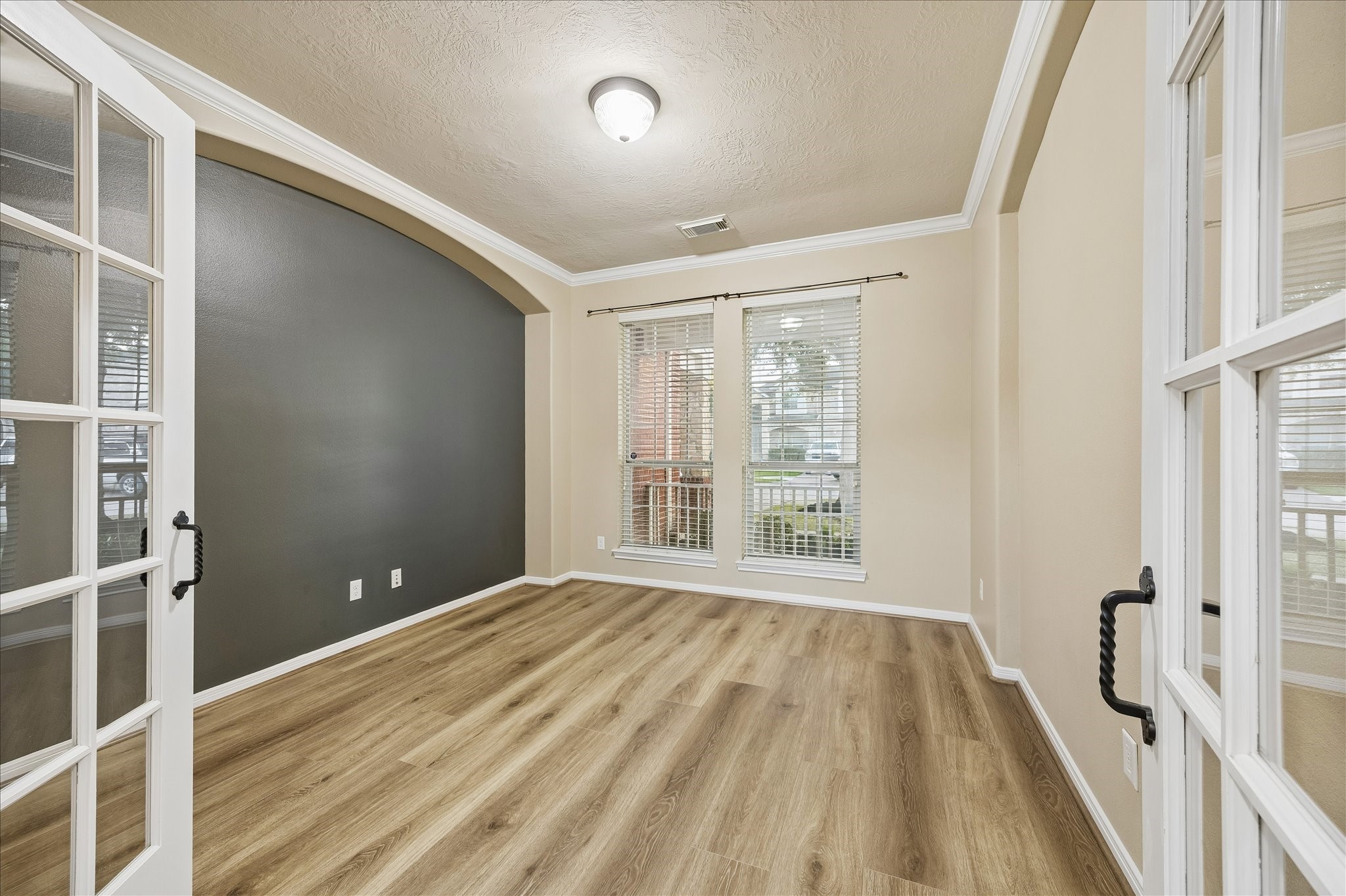 Cozy home office/study with french doors.