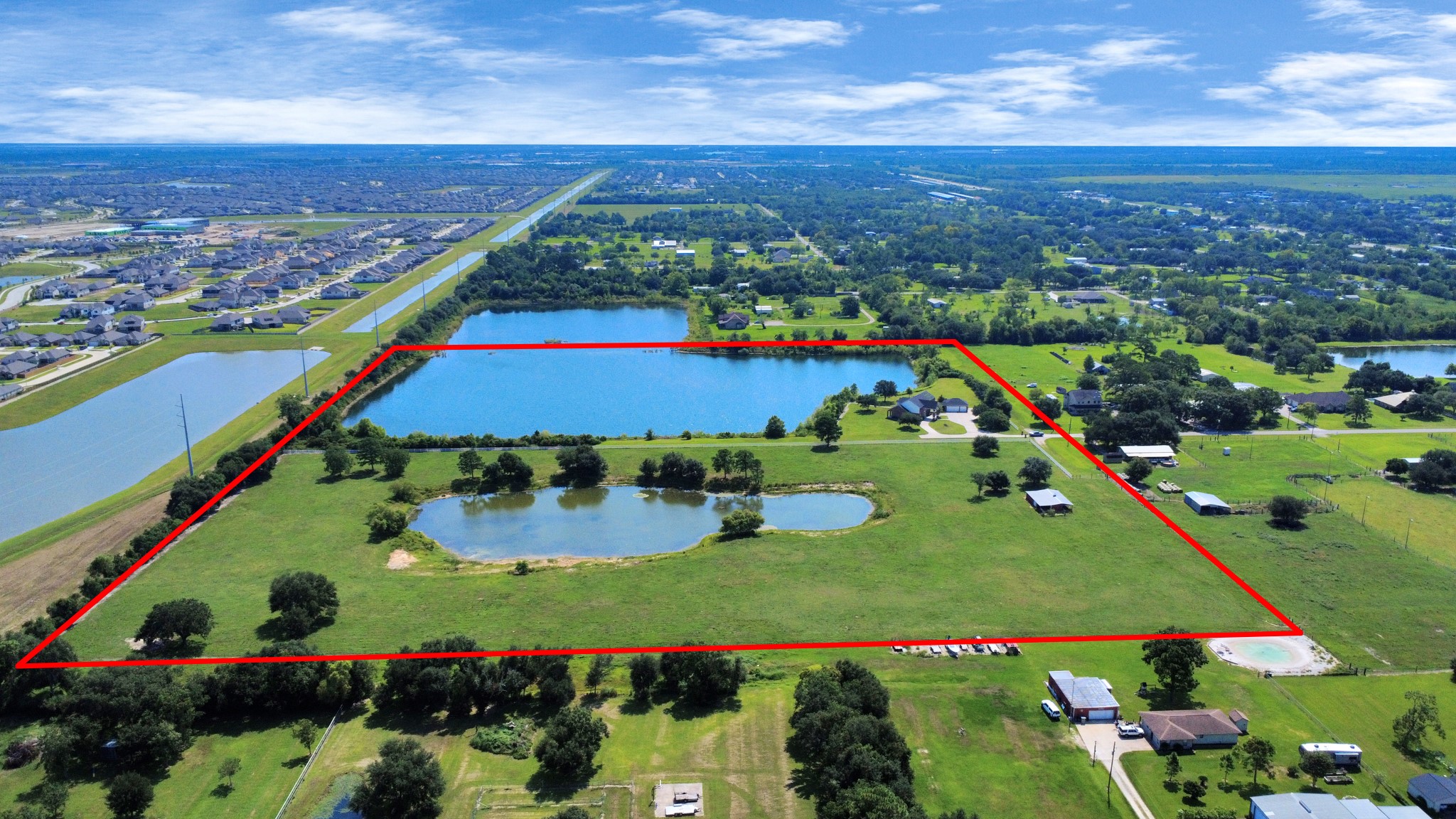 Both properties. Property line in red is not the exact property boundary line, It is showing what the seller iis currently using including the R.O.W. Buyer to verify property boundary lines.