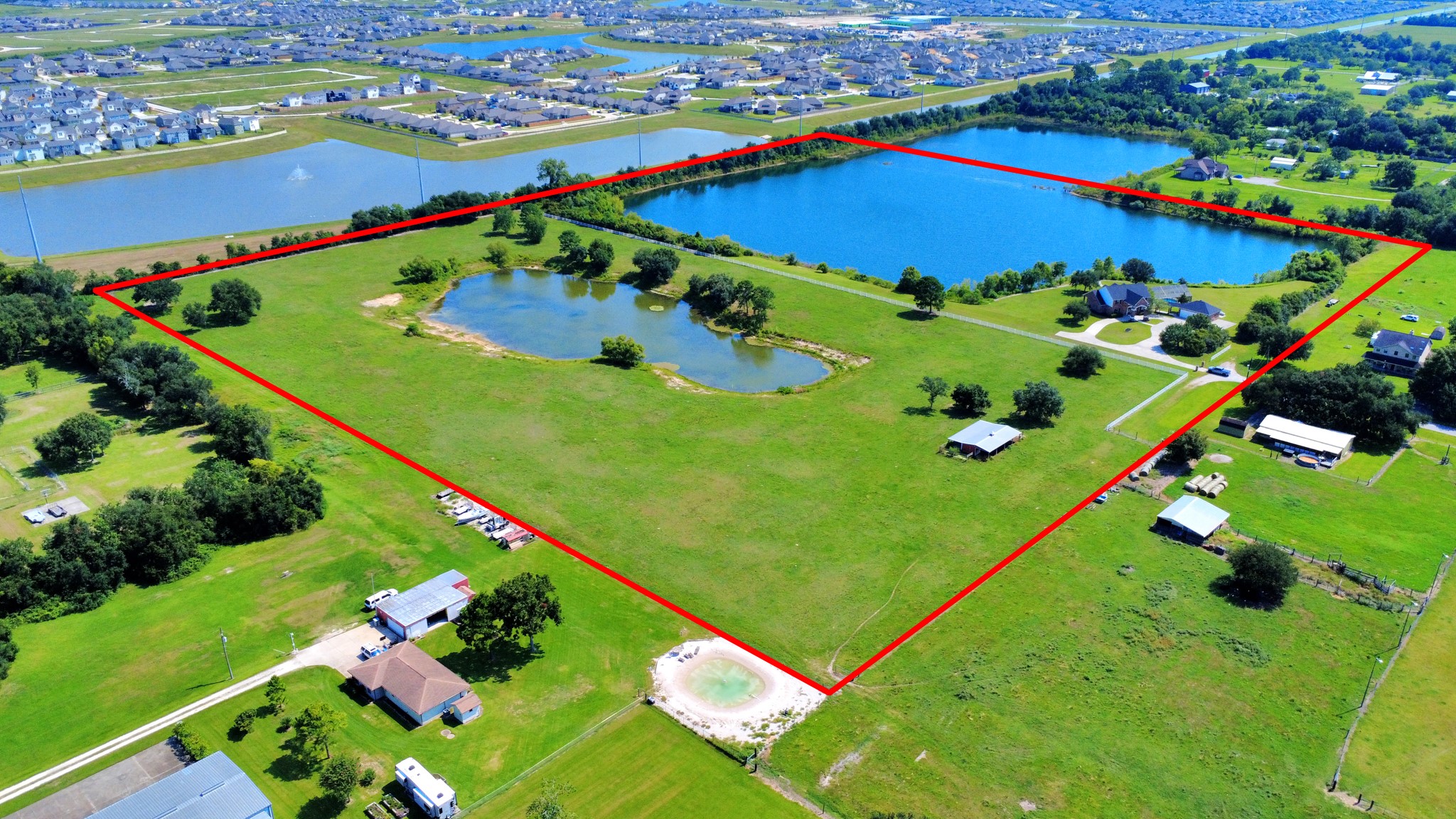 Both properties. Property line in red is not the exact property boundary line, It is showing what the seller iis currently using including the R.O.W. Buyer to verify property boundary lines.