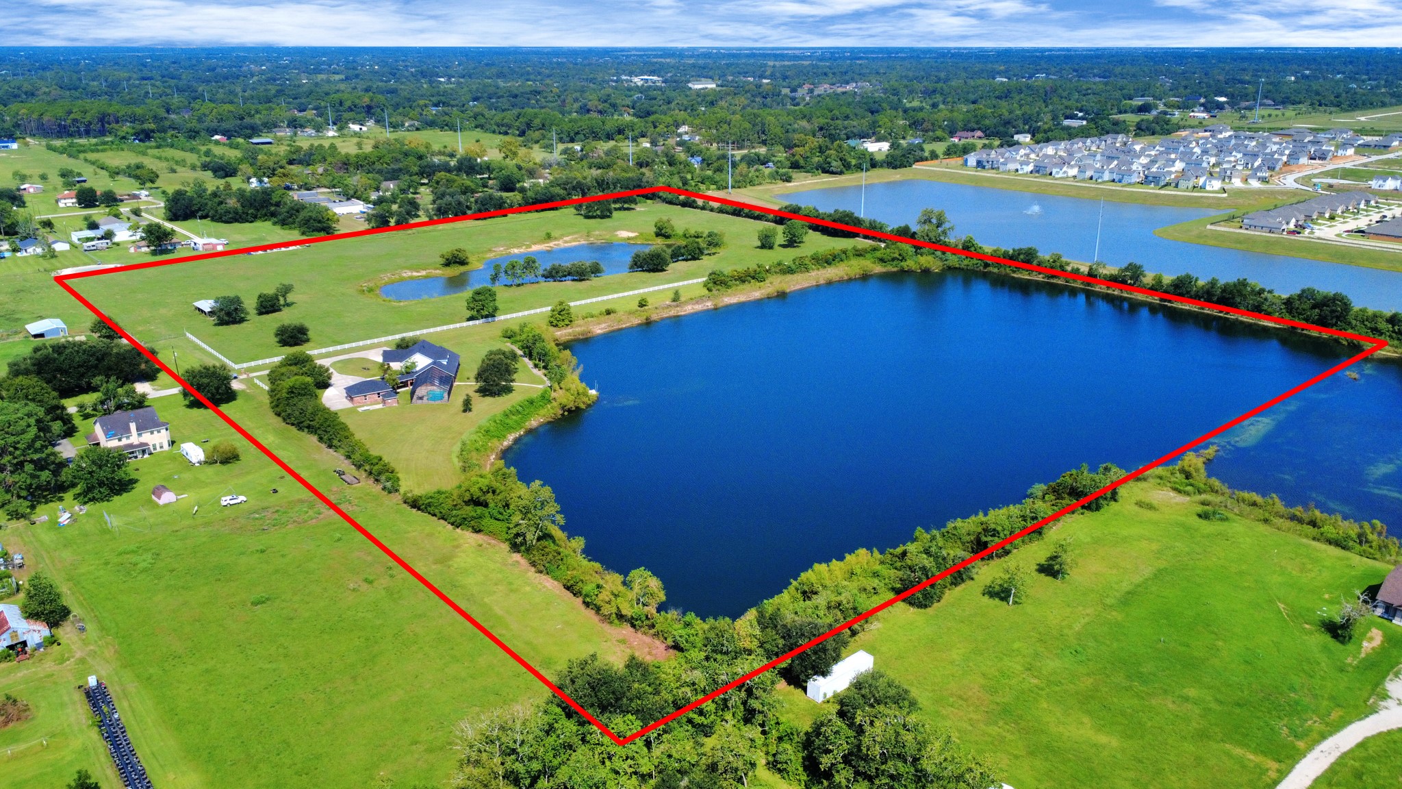 Both properties. Property line in red is not the exact property boundary line, It is showing what the seller iis currently using including the R.O.W. Buyer to verify property boundary lines.