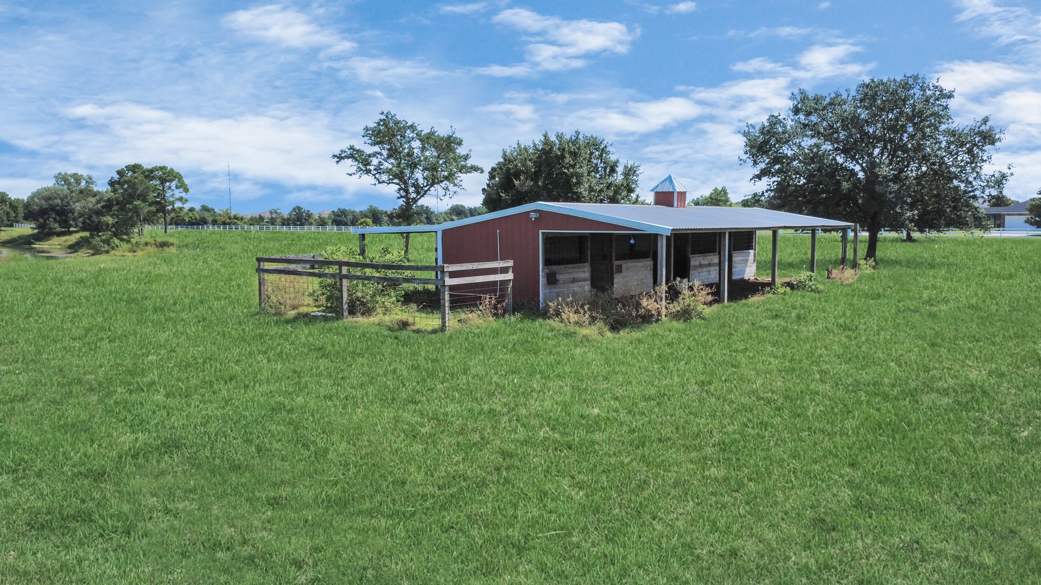 4 horse stable barn with additional storage.