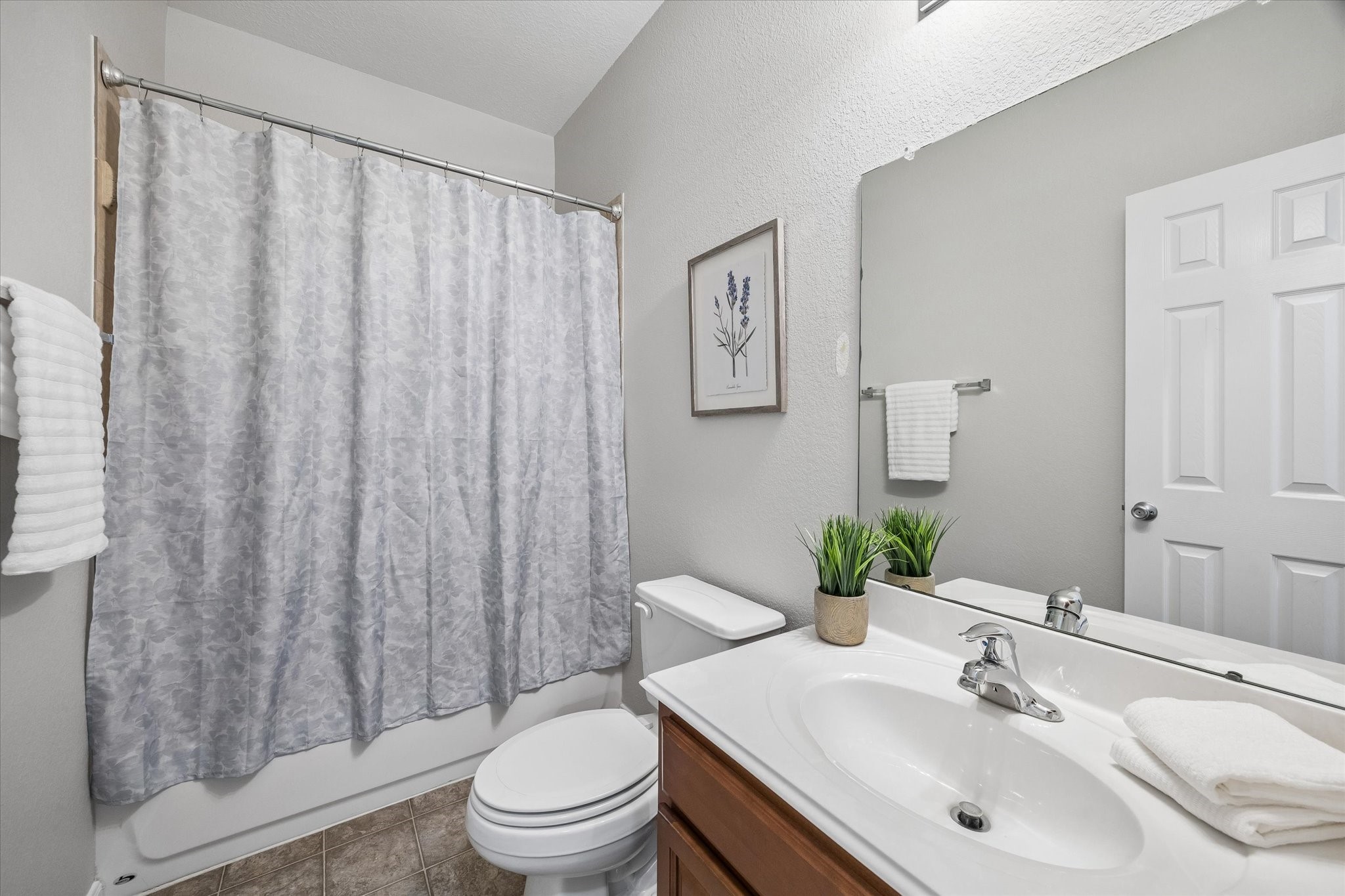 Secondary bedrooms share this spacious bathroom.