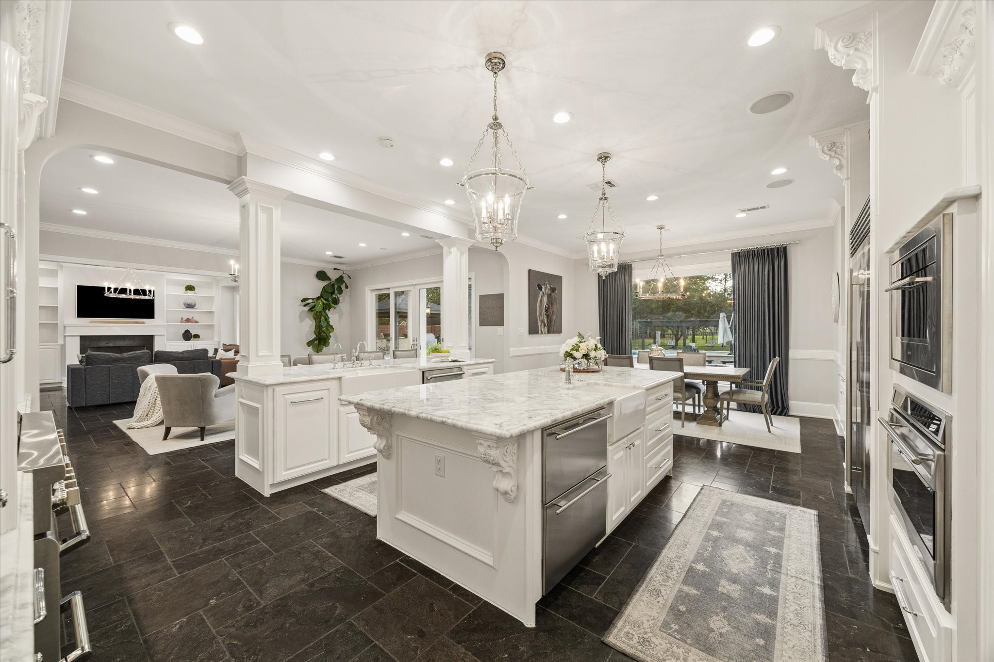 Another view of the timeless kitchen, featuring premium finishes, custom cabinetry, and high-end stainless steel appliances designed for both daily functionality and elegant entertaining.