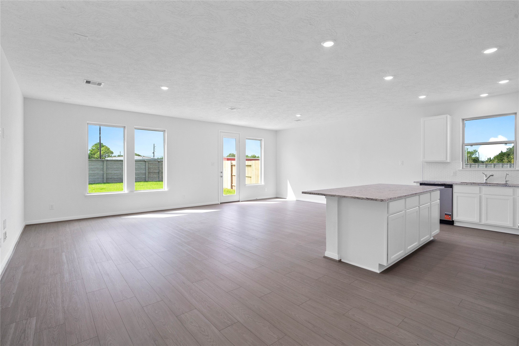 Welcome home to a bright, modern open concept living space hat perfectly sets the tone for this beautiful property. This inviting space features high-quality vinyl plank flooring that blends style and durability seamlessly.