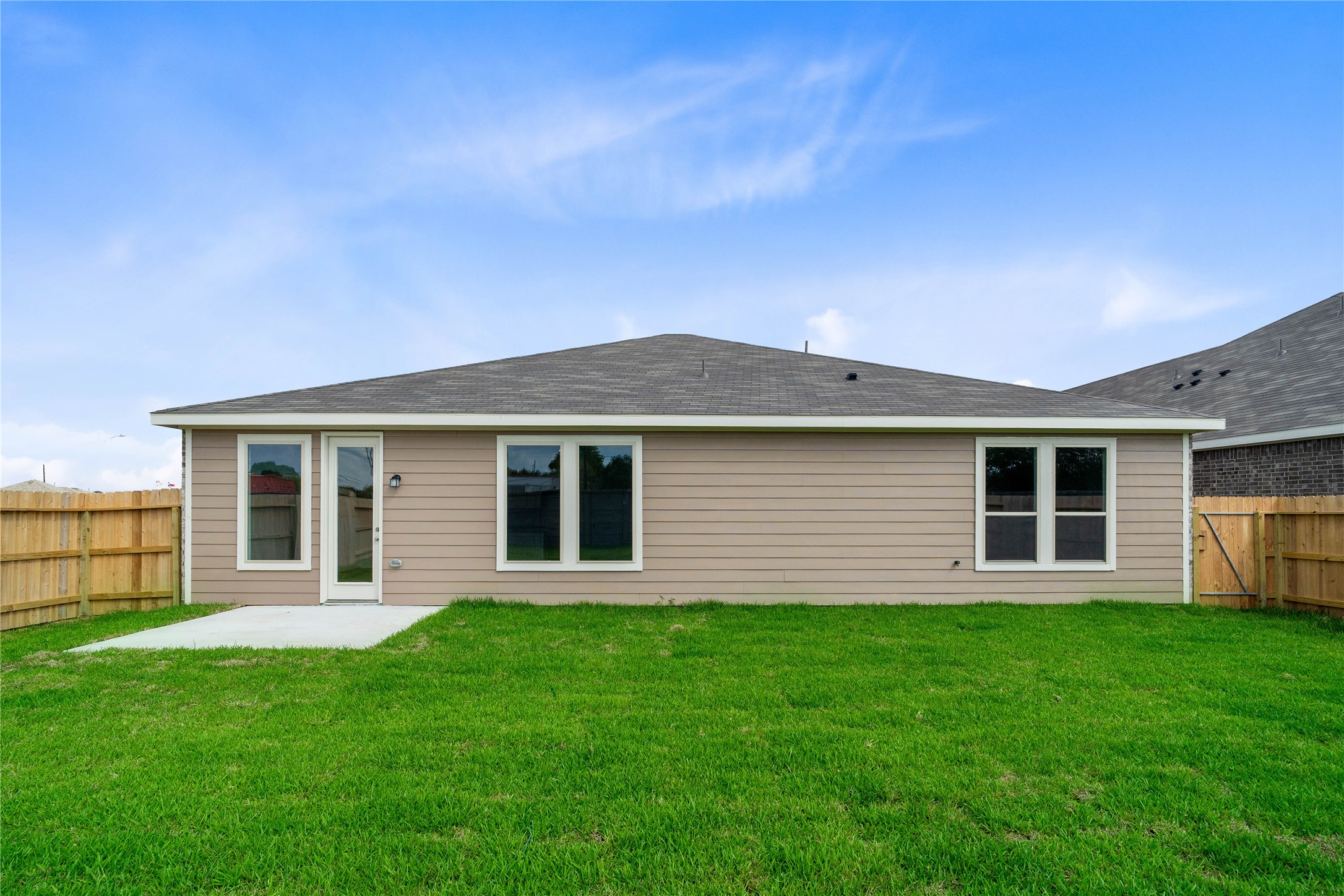 Come and see this spacious backyard and patio slab! There is plenty of room for the kids to play and adults to relax!