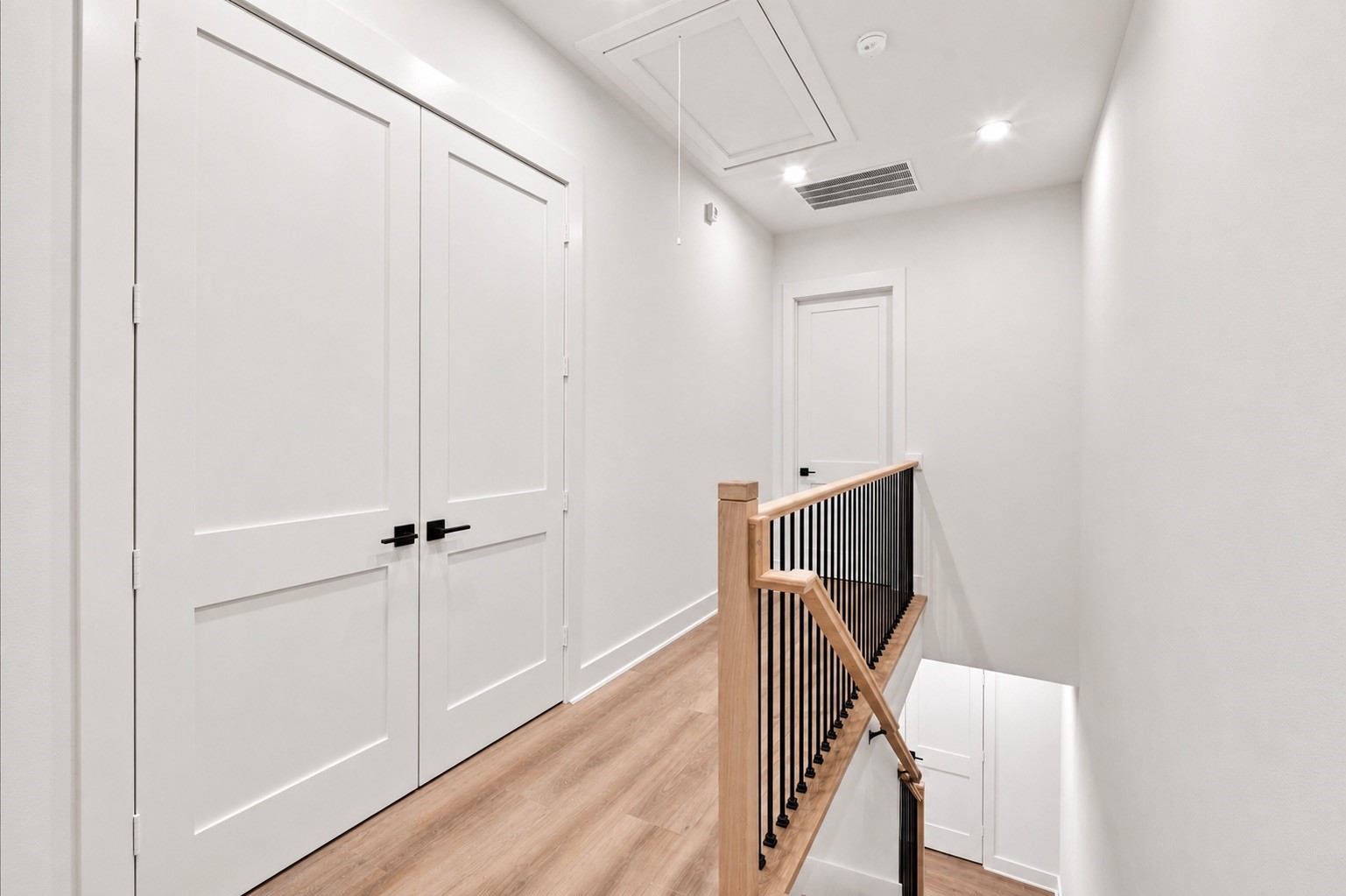 Top floor includes laundry room, primary bedroom and secondary bedroom.