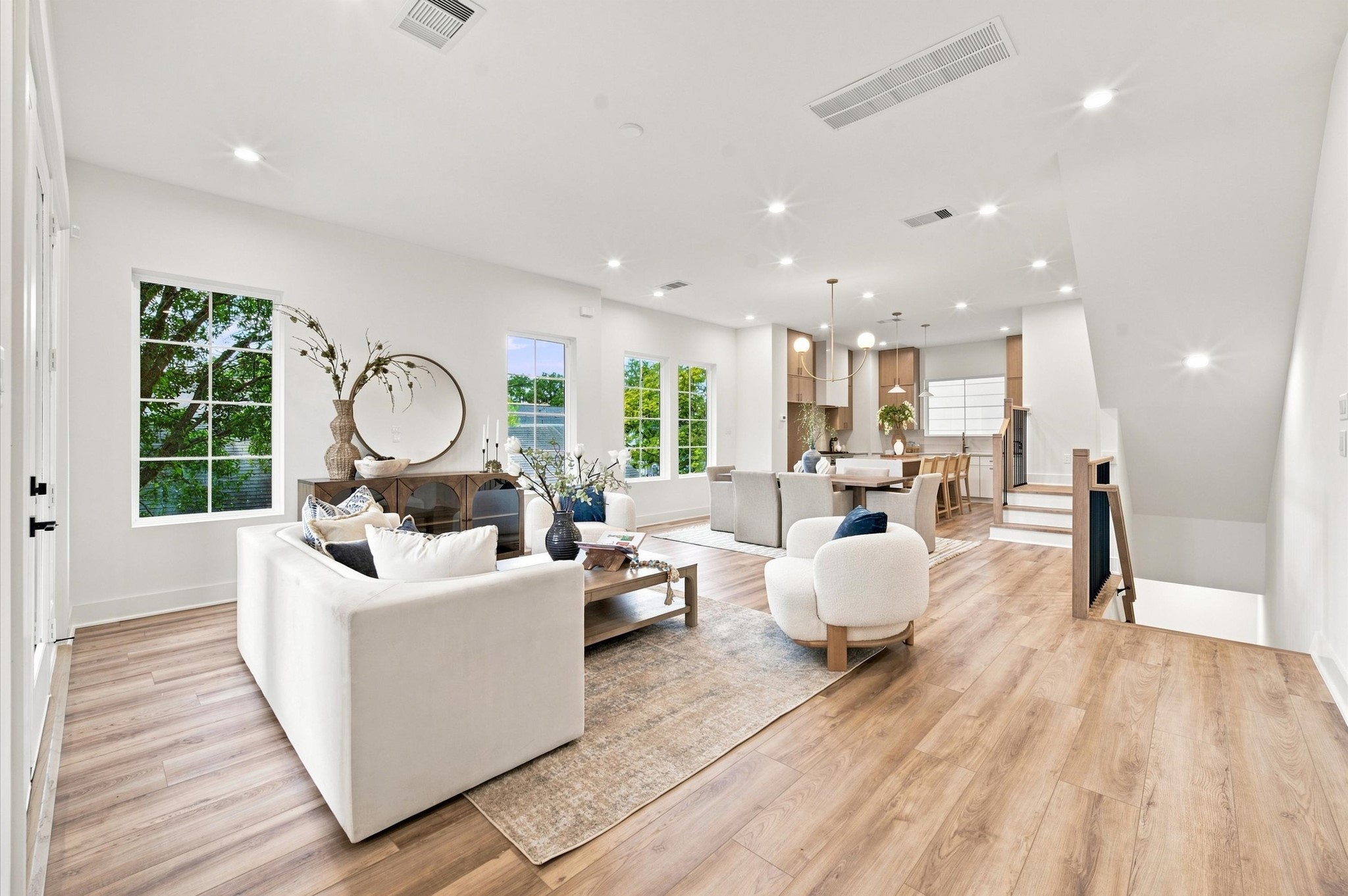 Open concept 2nd floor living, dining, and kitchen areas