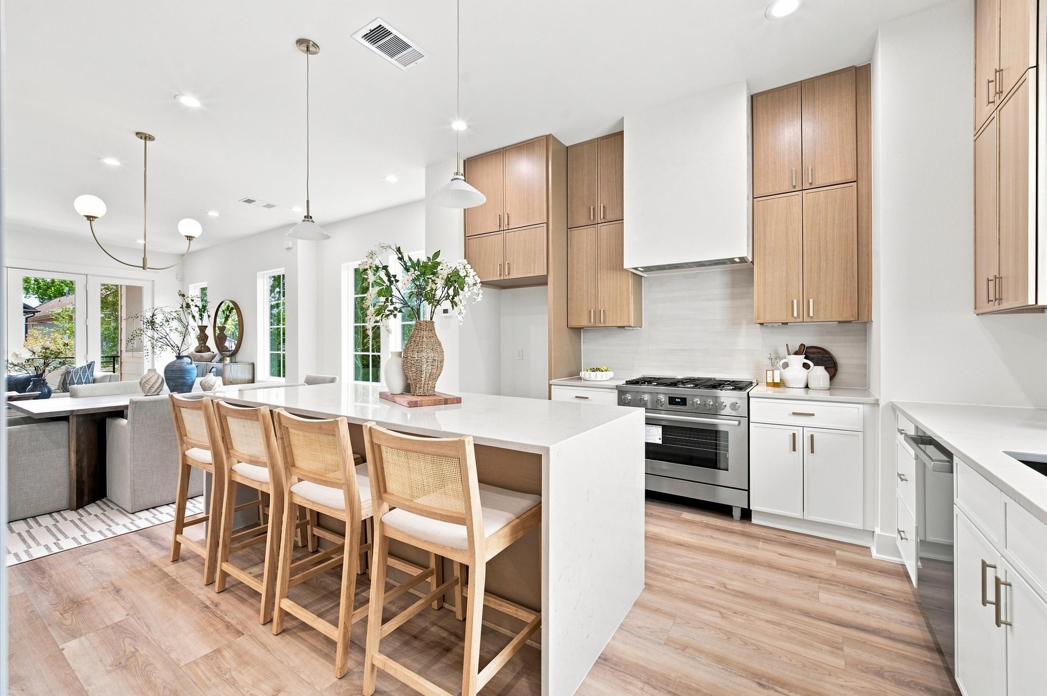 Stainless Steel Bosch appliances and white oak cabinetry.