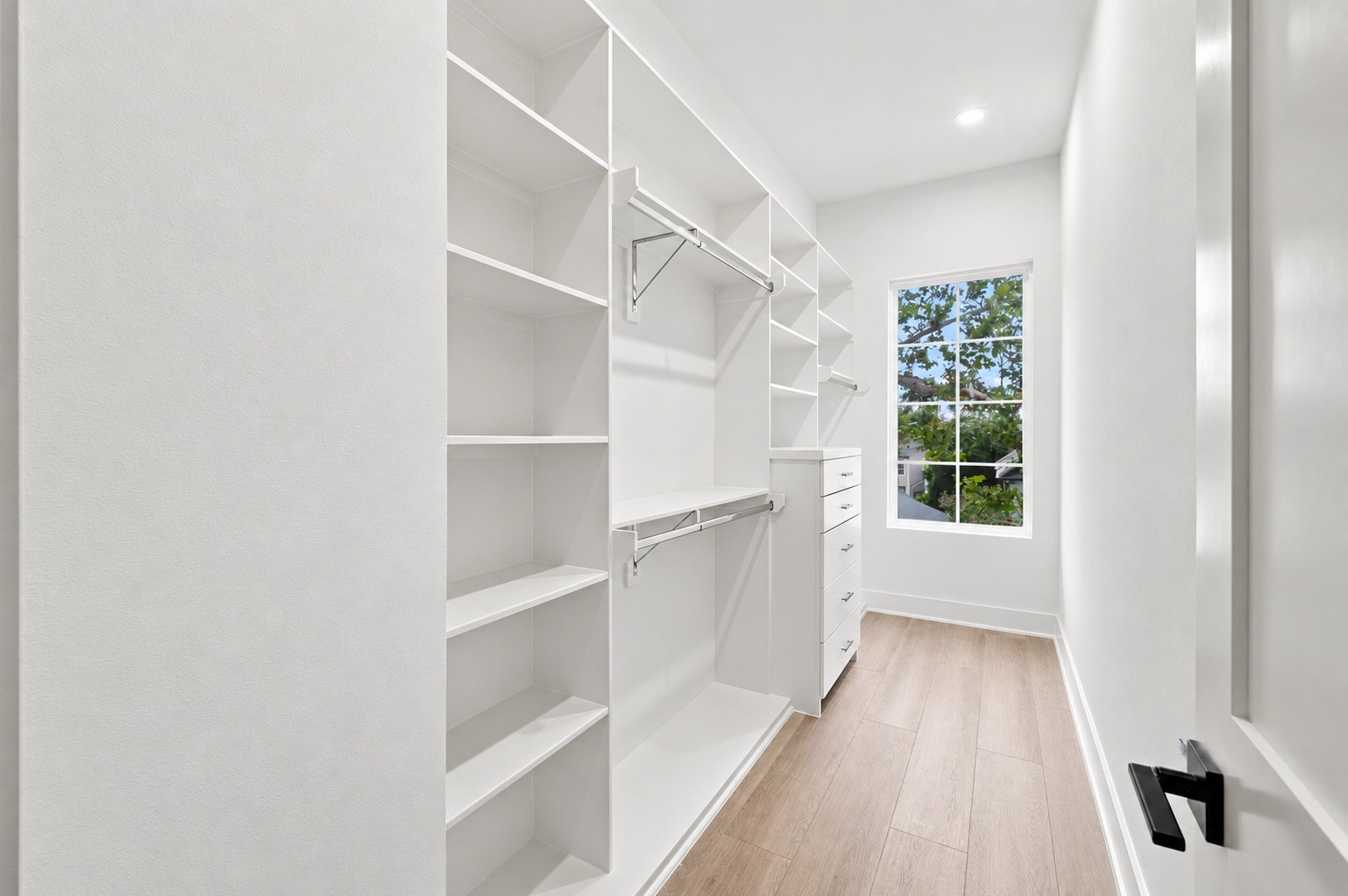 One of two primary closets.