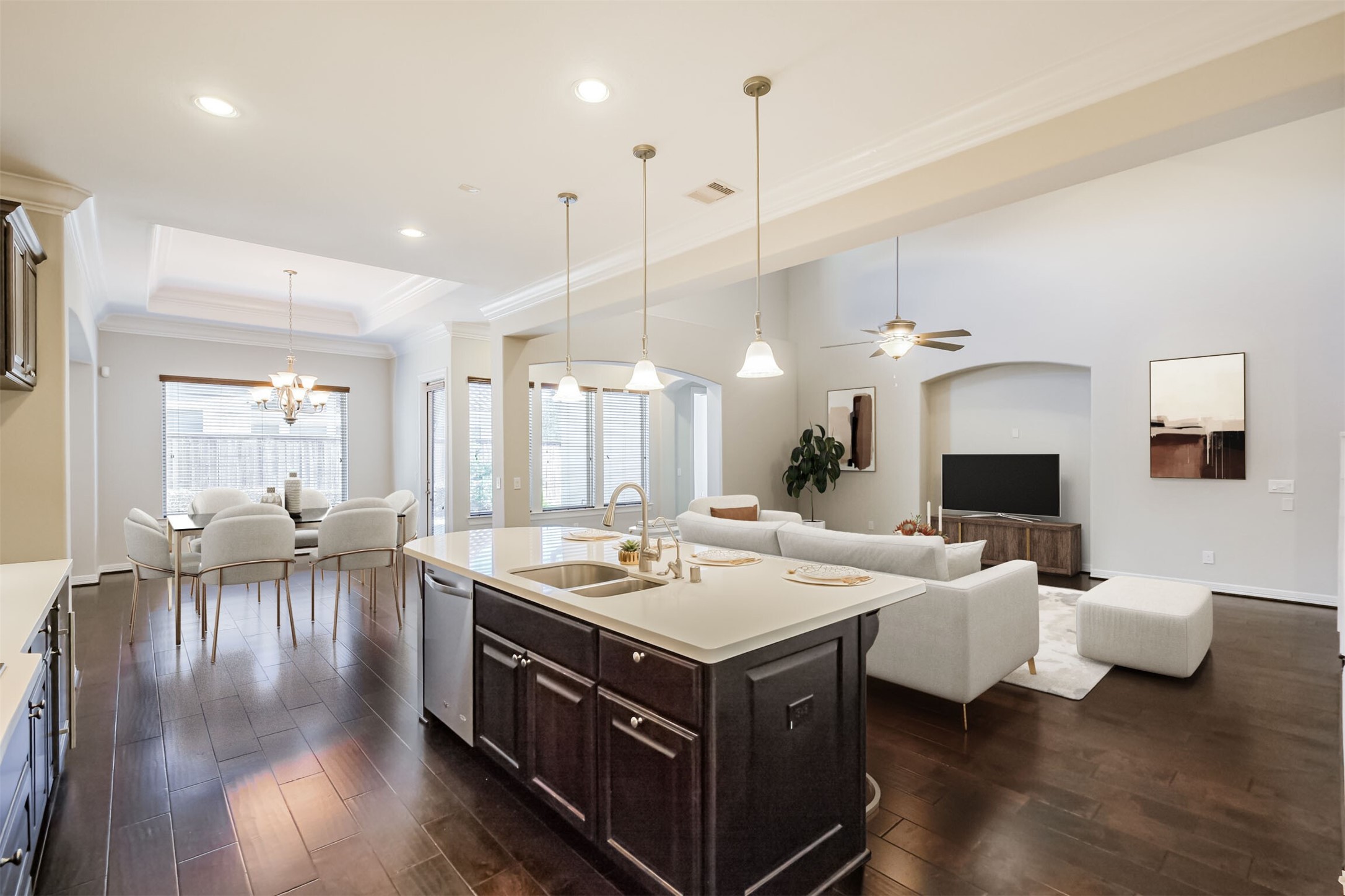 Chef's eye view of the living space. Cook up a storm but still be a part of the family activity! **Virtually Staged**